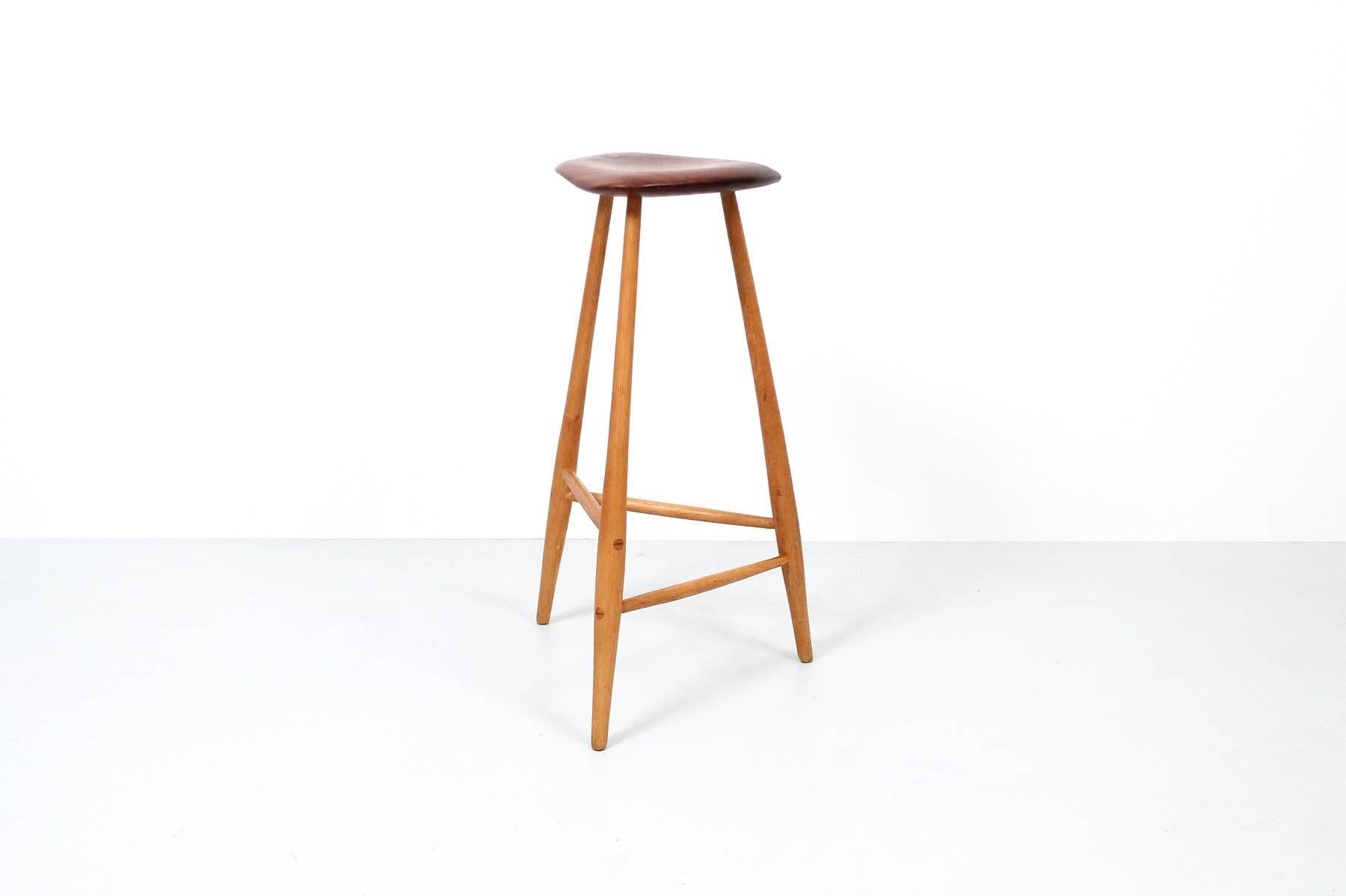 Studio furniture barstool by Horace B. Hartshaw. Hartshaw was Wharton Esherick's studio assistant. This stool is identical to those made by Esherick. Signed and dated. Walnut seat and hickory legs.