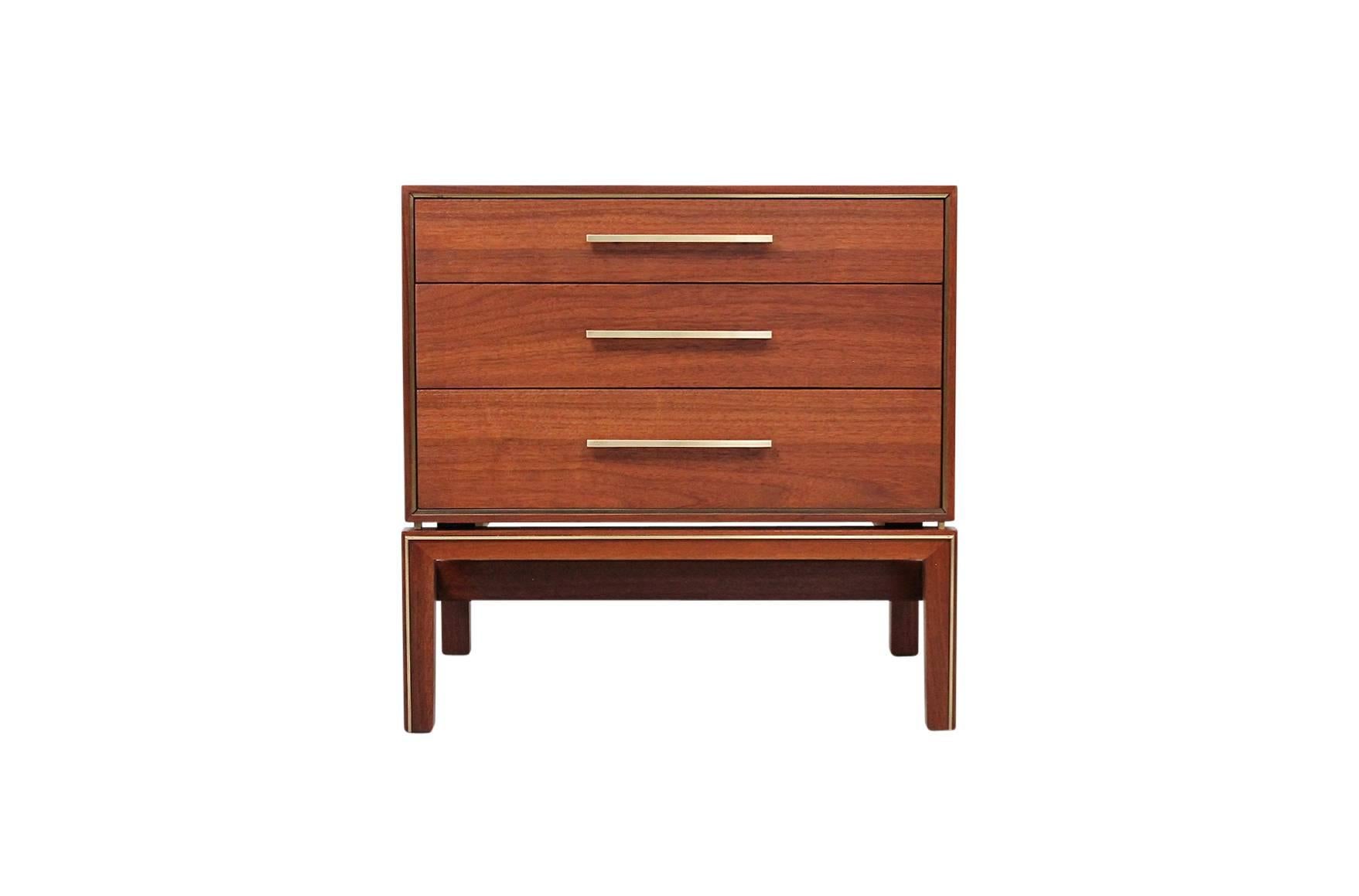 Pair of nightstands or small chests by Johnson Furniture. Attractive and useful pieces in walnut and brass.