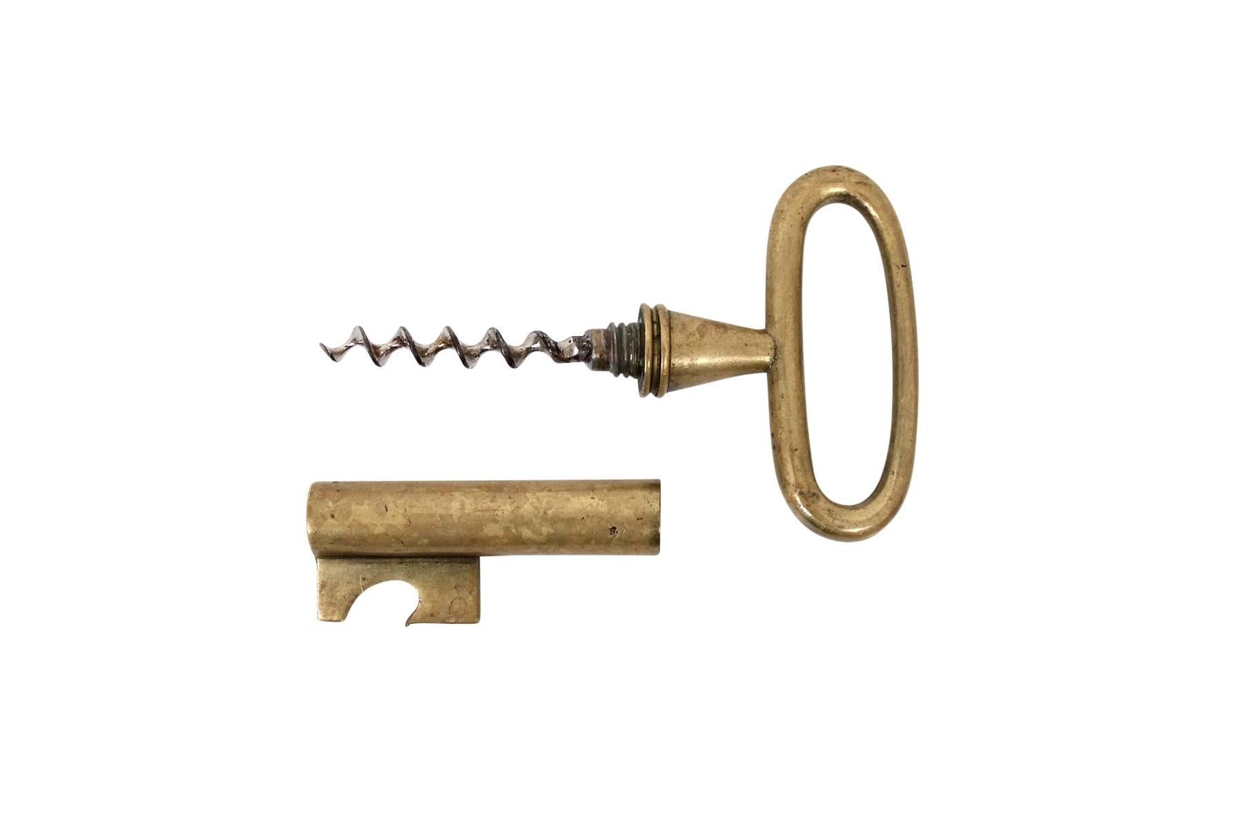 Carl Auböck brass key shaped corkscrew and bottle opener. Signed with impressed Auböck mark.