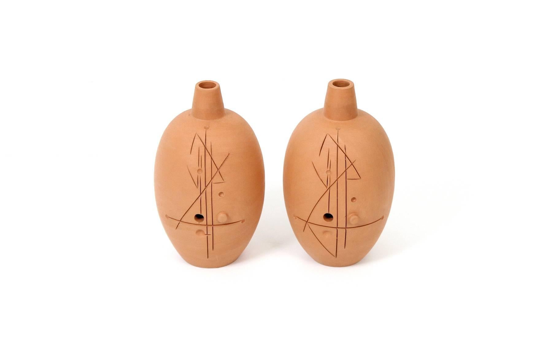Abstractly carved vases by Raymor. Design attributed to Bitossi. Marked to the underneath of one vase 