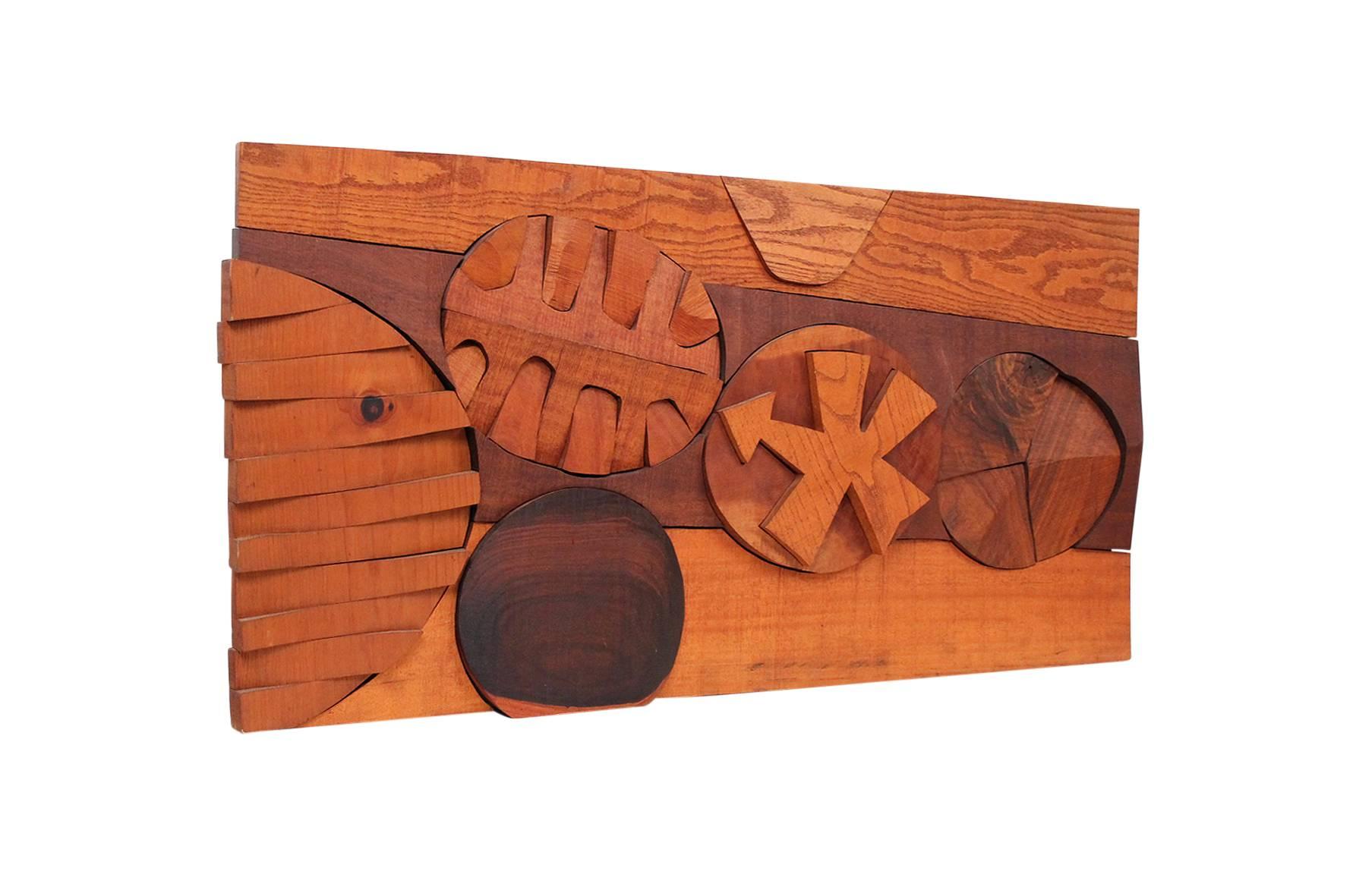 Hanging wood relief sculpture by American artist Hugh Townley. Townley exhibited widely including a show at MOMA in 1955. He taught at Brown University for 20+ years. Sculpture is signed at dated to the reverse "L9 Townley '67".
 