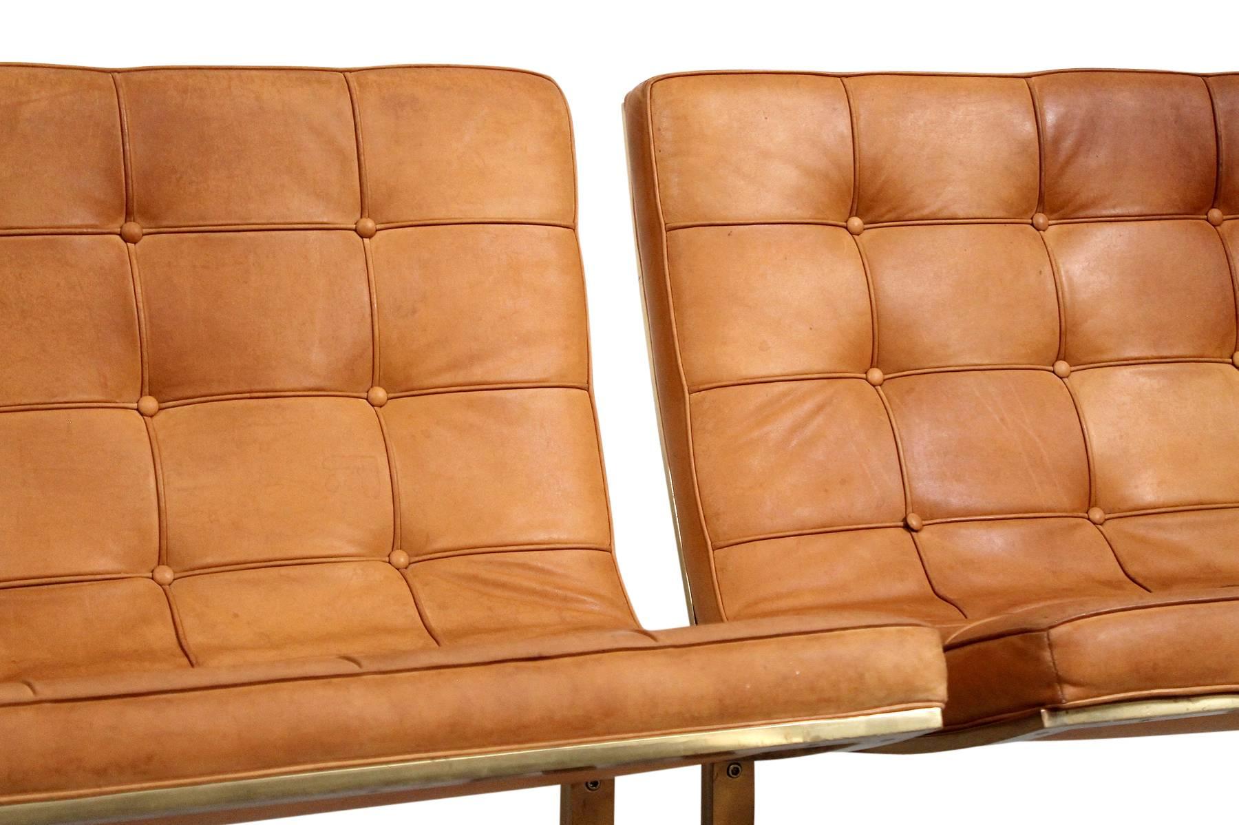 Brass Pair of Leather Lounge Chairs by Nicos Zographos