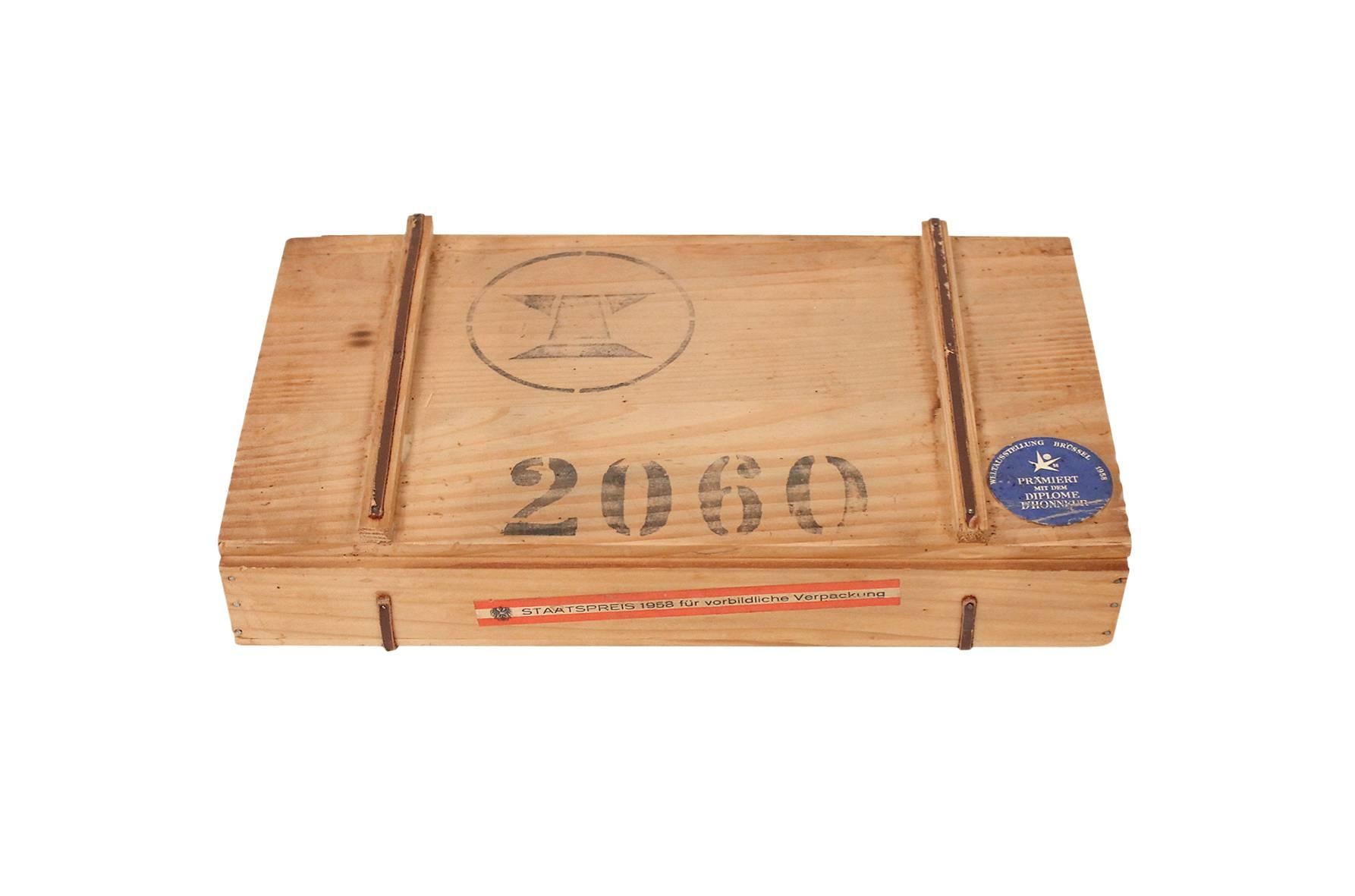 30 piece stainless steel flatware service designed by Carl Auböck for Amboss. This set is considered Model 2060 and includes its original box with Amboss stamps and branding. Includes 6 soup spoons, 6 forks, 6 knives, 6 individual salad forks, and 6