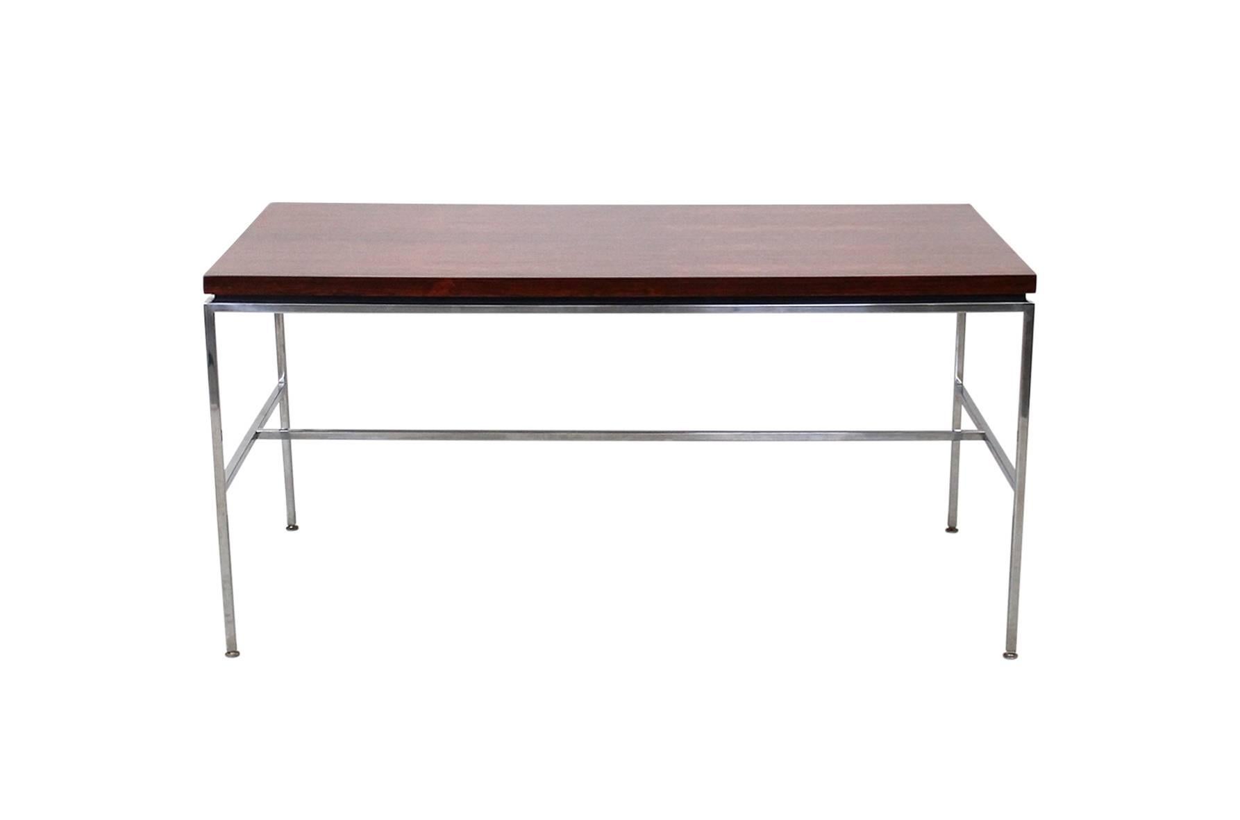 Minimalist desk by Drexel. This seldom seen design by the American company features a floating exotic wood top over steel base. Suitable as a writing desk or work table.