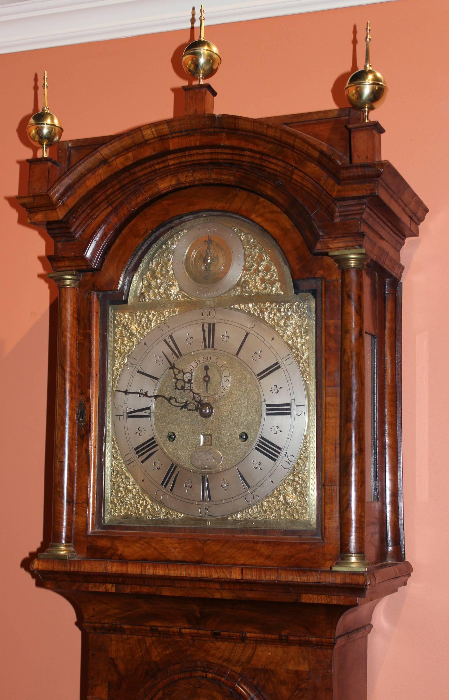 An exceptional and rare English burled walnut veneered and inlaid tall case clock by William Webster with 30 day brass movement. The silvered dial engraved “Wm Webster, Exchange Alley, London”.

The tall clock is in excellent working condition and