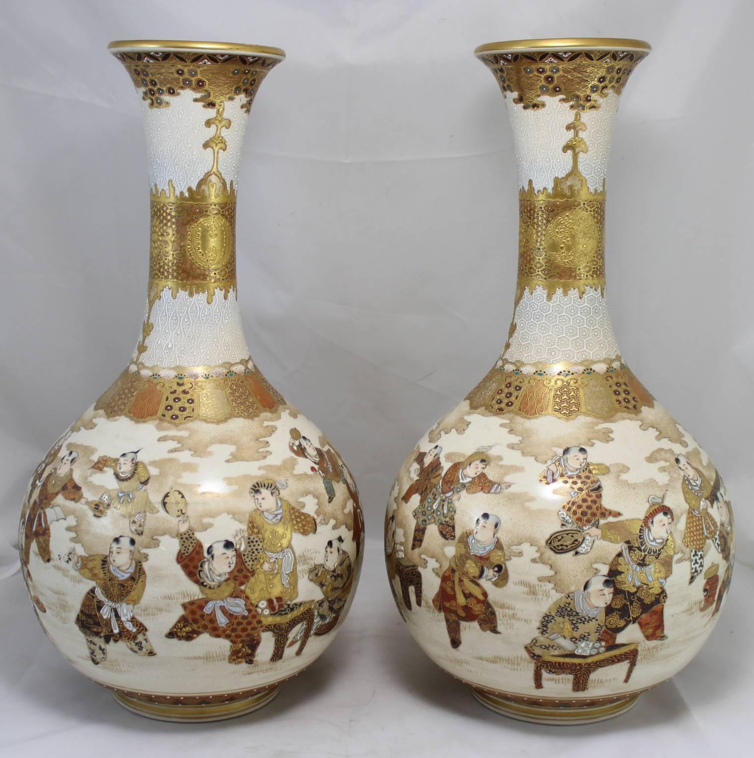 This is a splendid pair of polychrome Meiji period Japanese Satsuma bulbous form vases, unsigned, each depicting a continuous scene with multiple figures around the body of the vase, highlighted with gilt decoration overall.