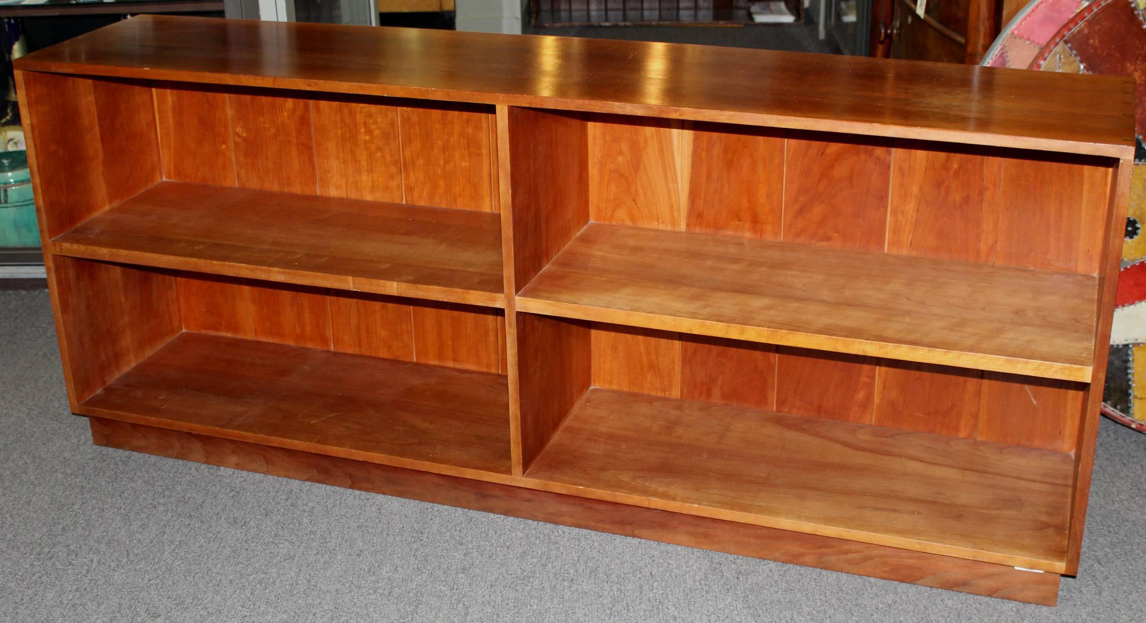 A beautiful cherrywood long bookcase by well known American furniture maker Thomas Moser with four compartments and solid dovetail construction. Signed and dated.