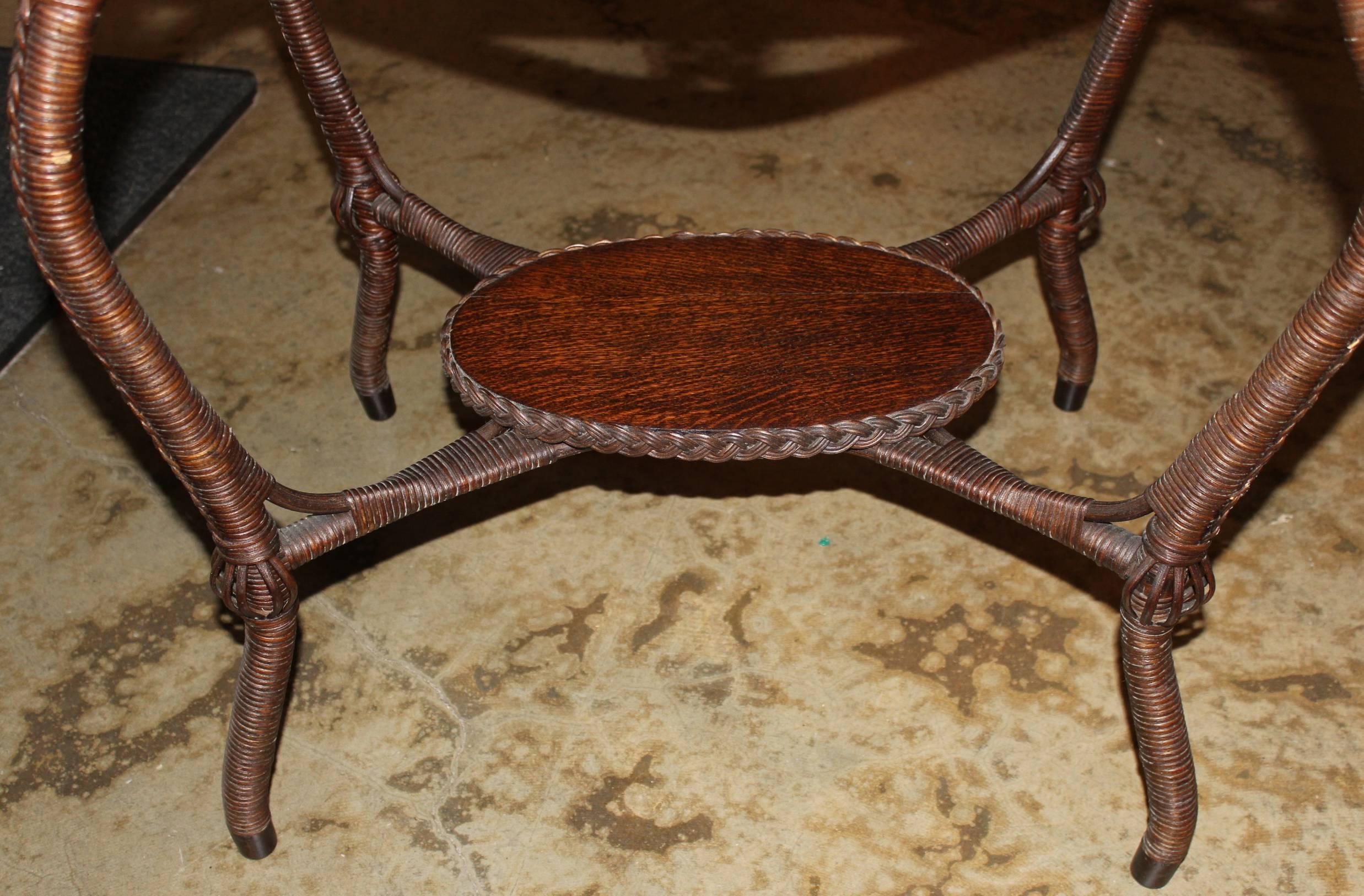 American Heywood Bros & Co Oak Two-Tier Wicker and Oak Oval Table