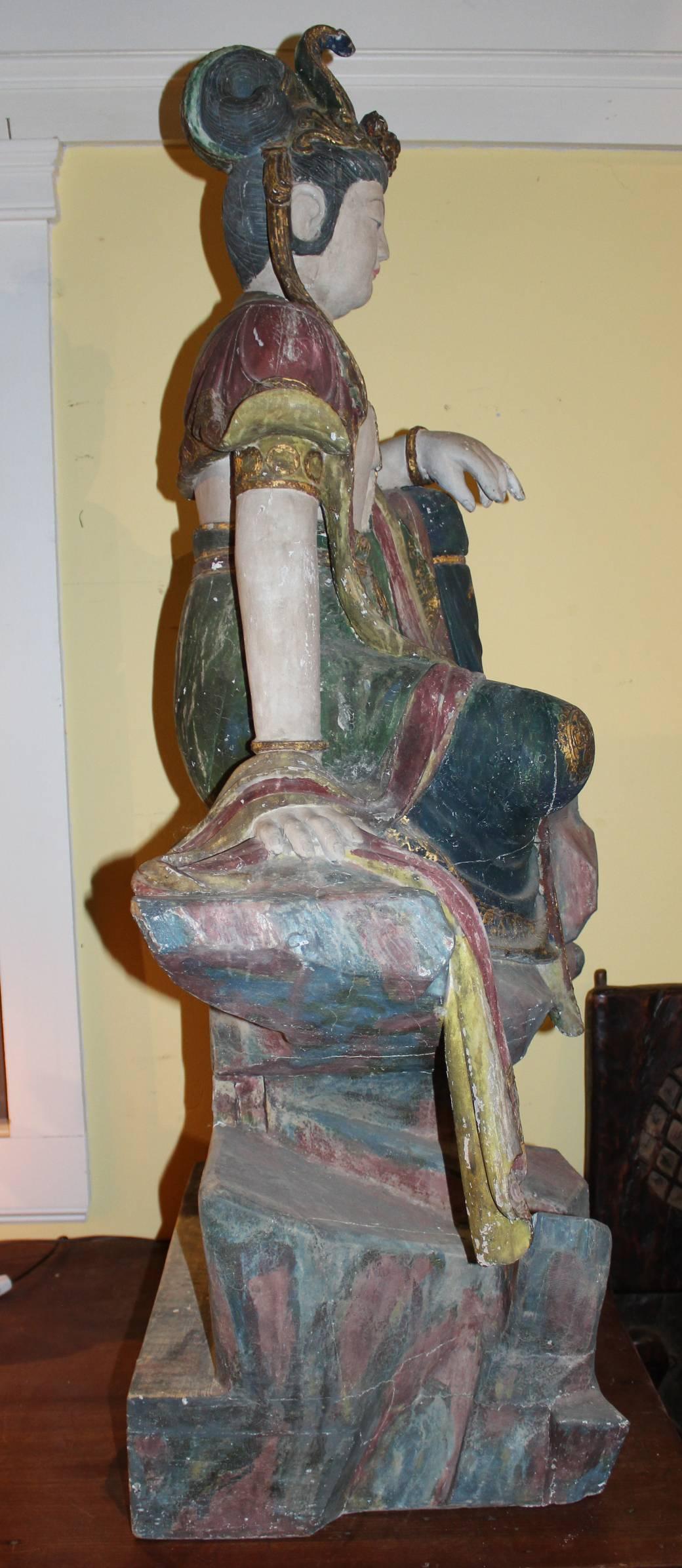 East Asian Polychrome Carved Wooden Seated Figure of Guanyin