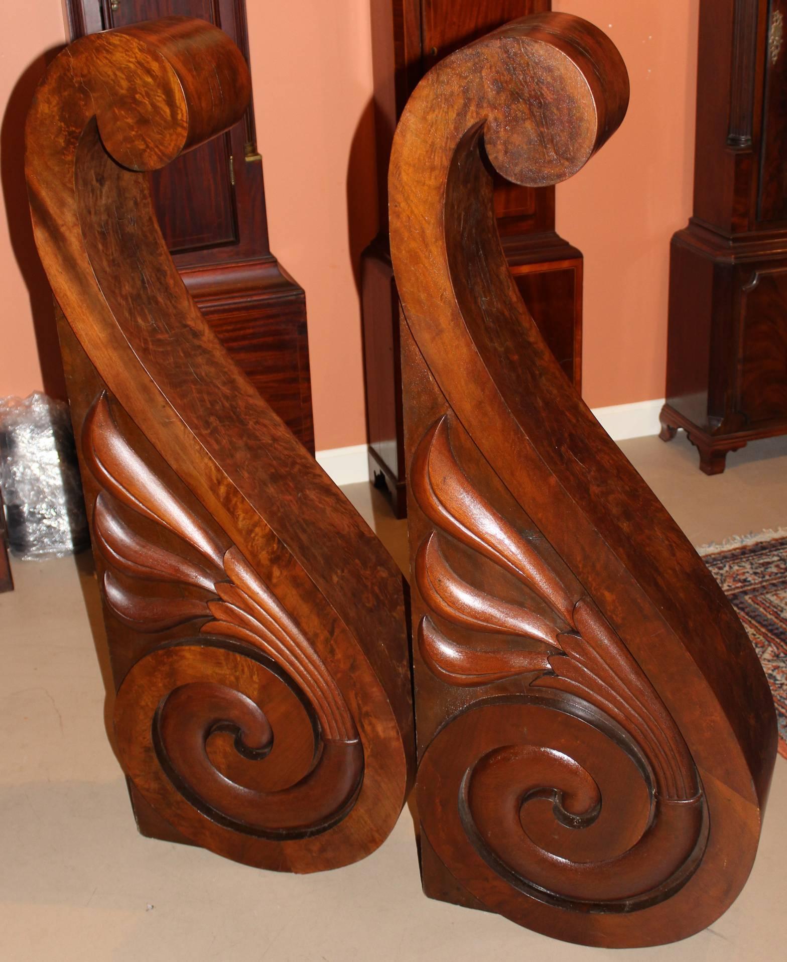 A spectacular large pair of carved wooden scroll form corbels, with mahogany and or walnut veneers, signed on the interior by the craftsman, S.D. Willis, Fitchburg, MA. Rare large size and form in a nice state of preservation.

These could also be