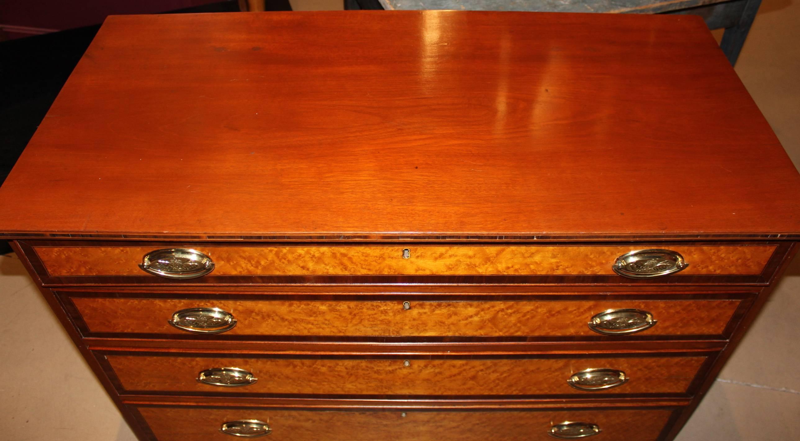 A fine Hepplewhite, federal period graduated four drawer chest of drawers with bird's-eye maple drawer fronts with banding. Cherry and mahogany with pine secondary woods. Case nicely raised by well proportioned French feet and simple line inlay on