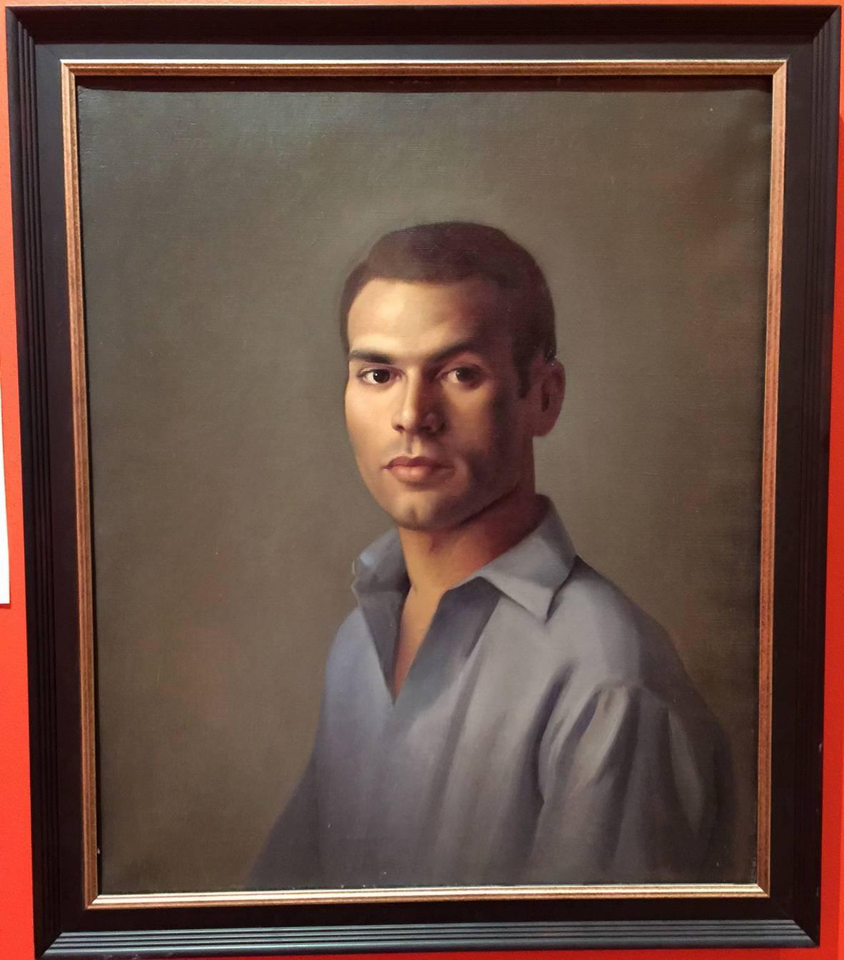 This well done portrait of a young man was painted by Italian/American artist Luigi Lucioni (1900-1988). Lucioni was born in Malnate, Italy and emigrated with his parents to New York, where he became very well known for his still life paintings with