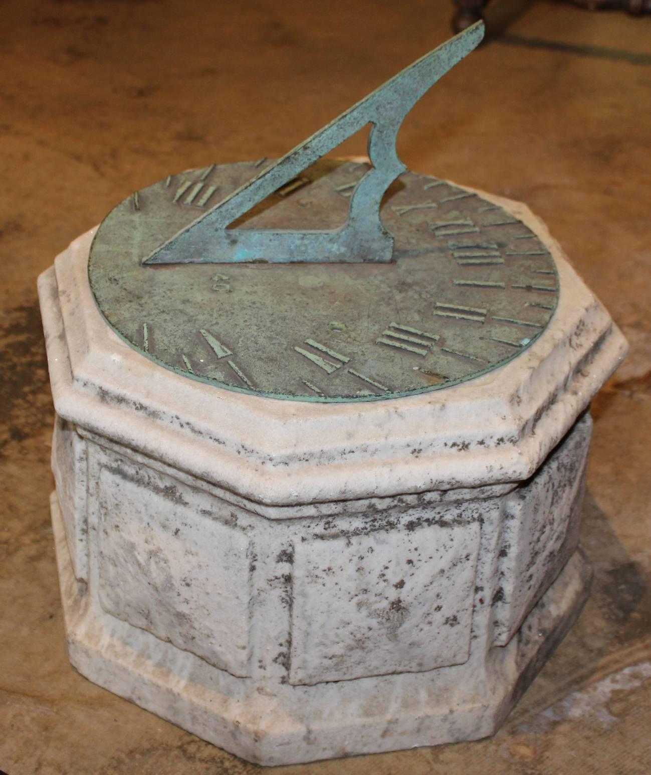 A nice bronze sundial with Roman numerals, with great verdigris, marked LAT 40, with an octagonal marble base with worn side panels and overall great patina. Probably dates to the late 19th or early 20th century, with an earlier plinth base, and is