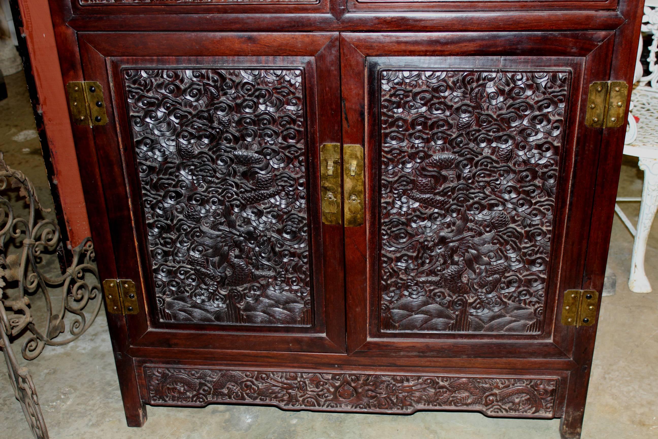 20th Century Pair of Carved Chinese Rosewood Etageres or Collectors Cabinets