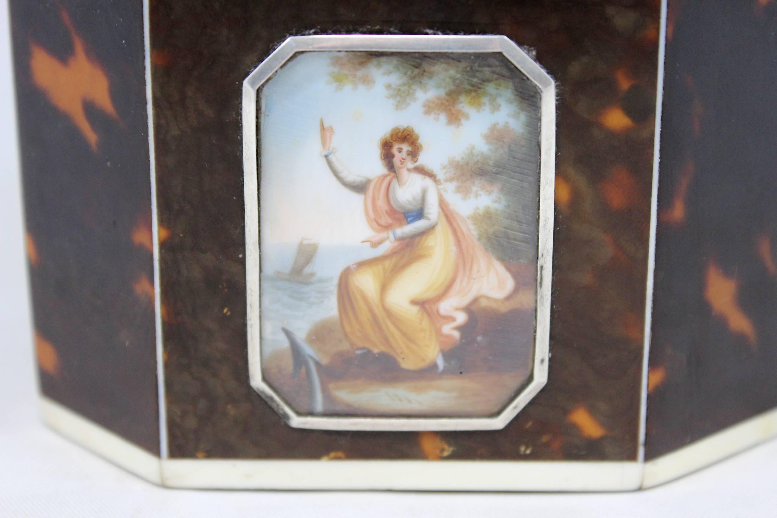 An exceptional quality late 18th century English octagonal tea caddy in tortoise shell with a reverse painted allegorical lozenge on the front. Excellent overall condition, with some interior lining losses.
