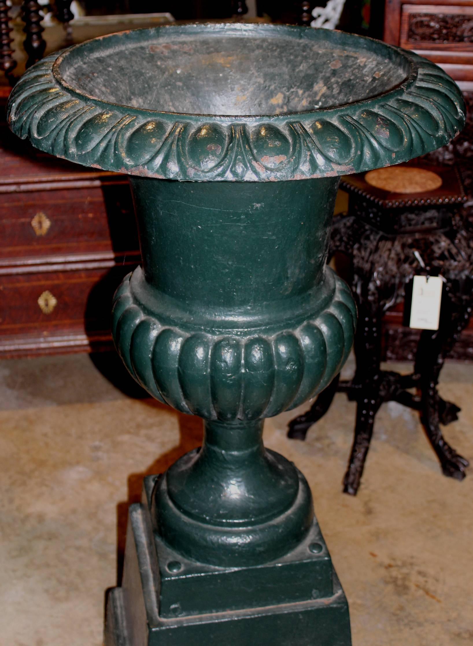 Late Victorian Pair of Green Painted Victorian Iron Urns on Attached Bases