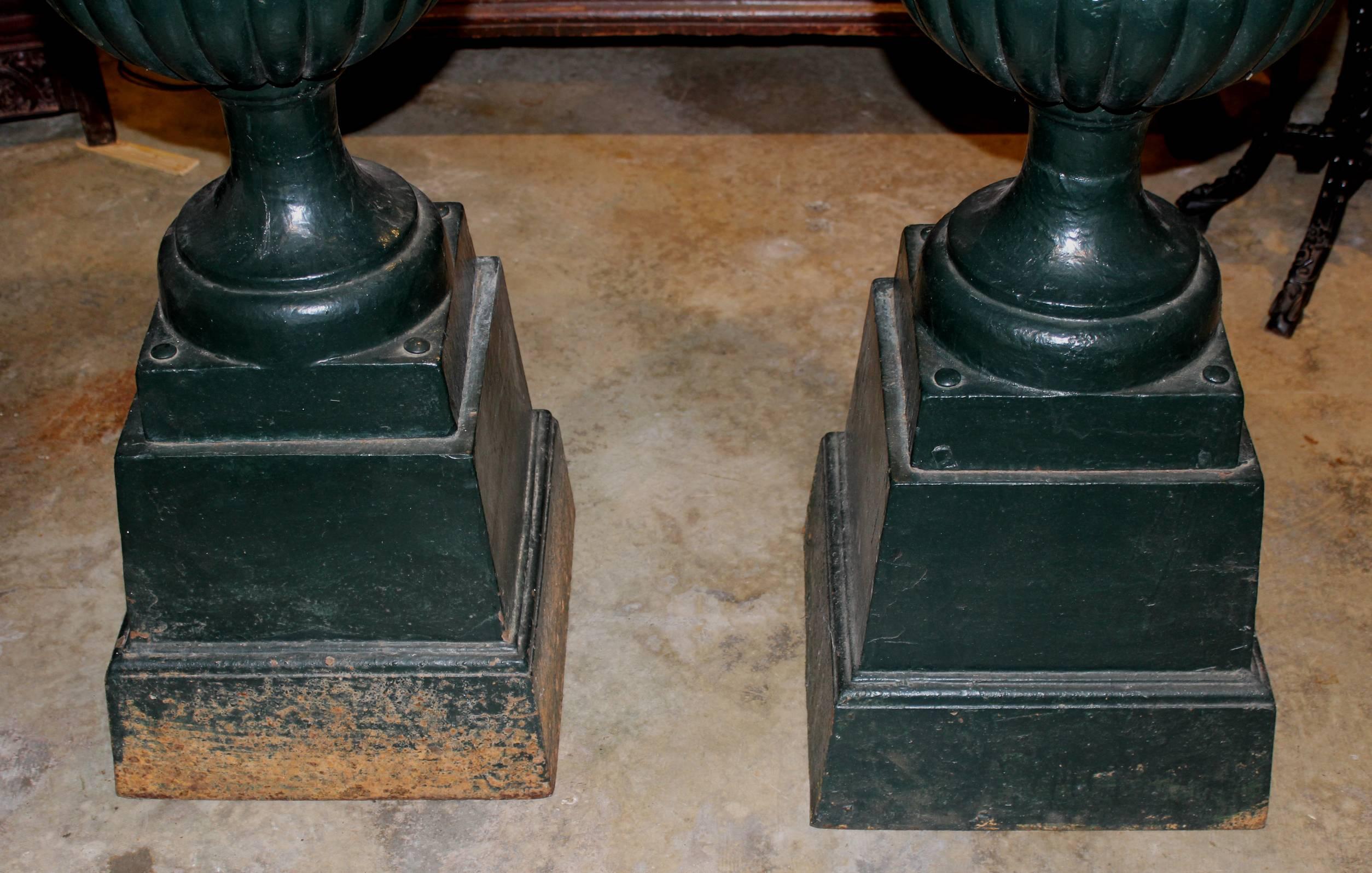 American Pair of Green Painted Victorian Iron Urns on Attached Bases