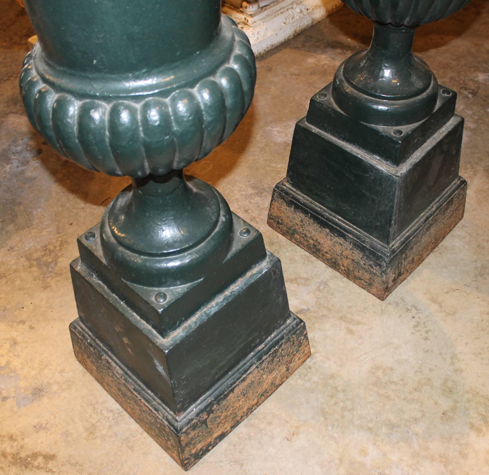 19th Century Pair of Green Painted Victorian Iron Urns on Attached Bases