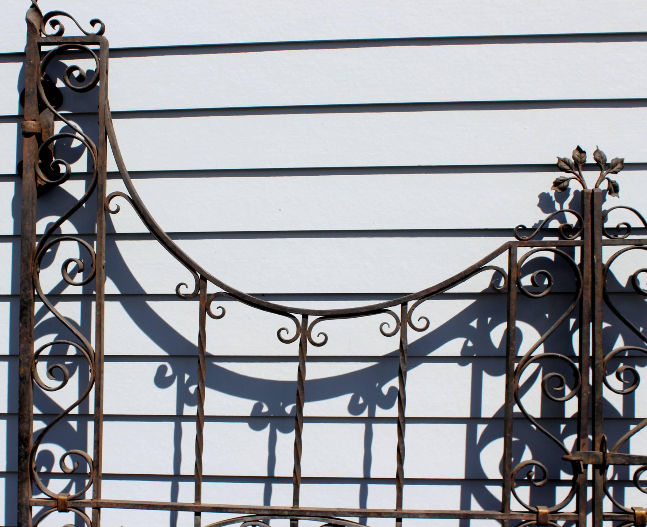 American Pair of Polychrome Iron Garden Gates with Urn and Rose Decoration