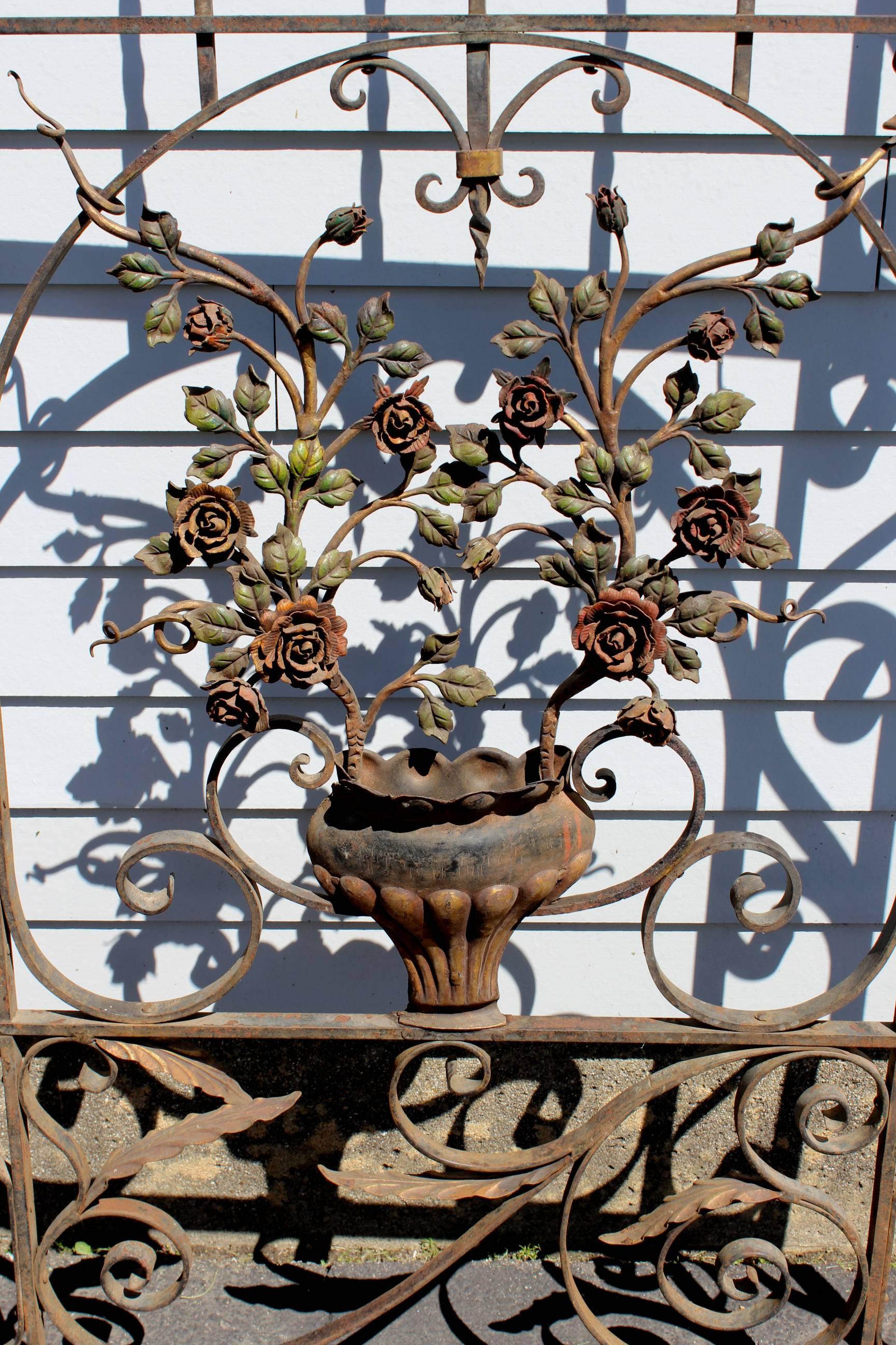 Polychromed Pair of Polychrome Iron Garden Gates with Urn and Rose Decoration