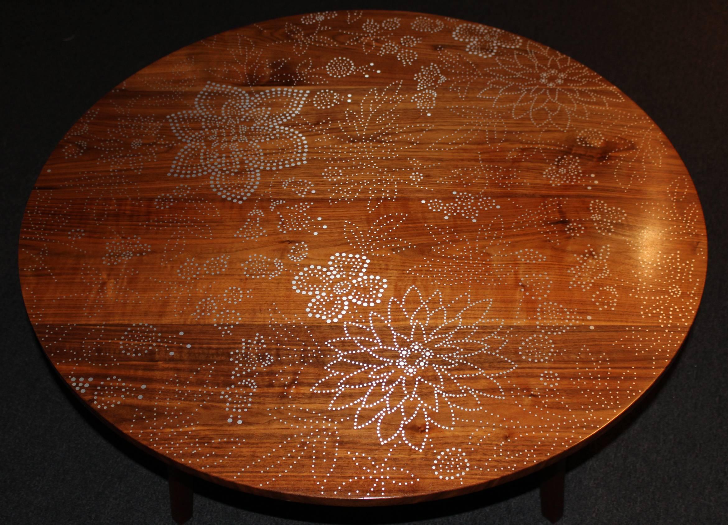A fine custom modernist low round nail table in bleached walnut and baked maple and a floral aluminum nail pattern, handcrafted by Peter Sandback. Sandback has gained a national reputation for his intricate pattern work of inlaid nails set into