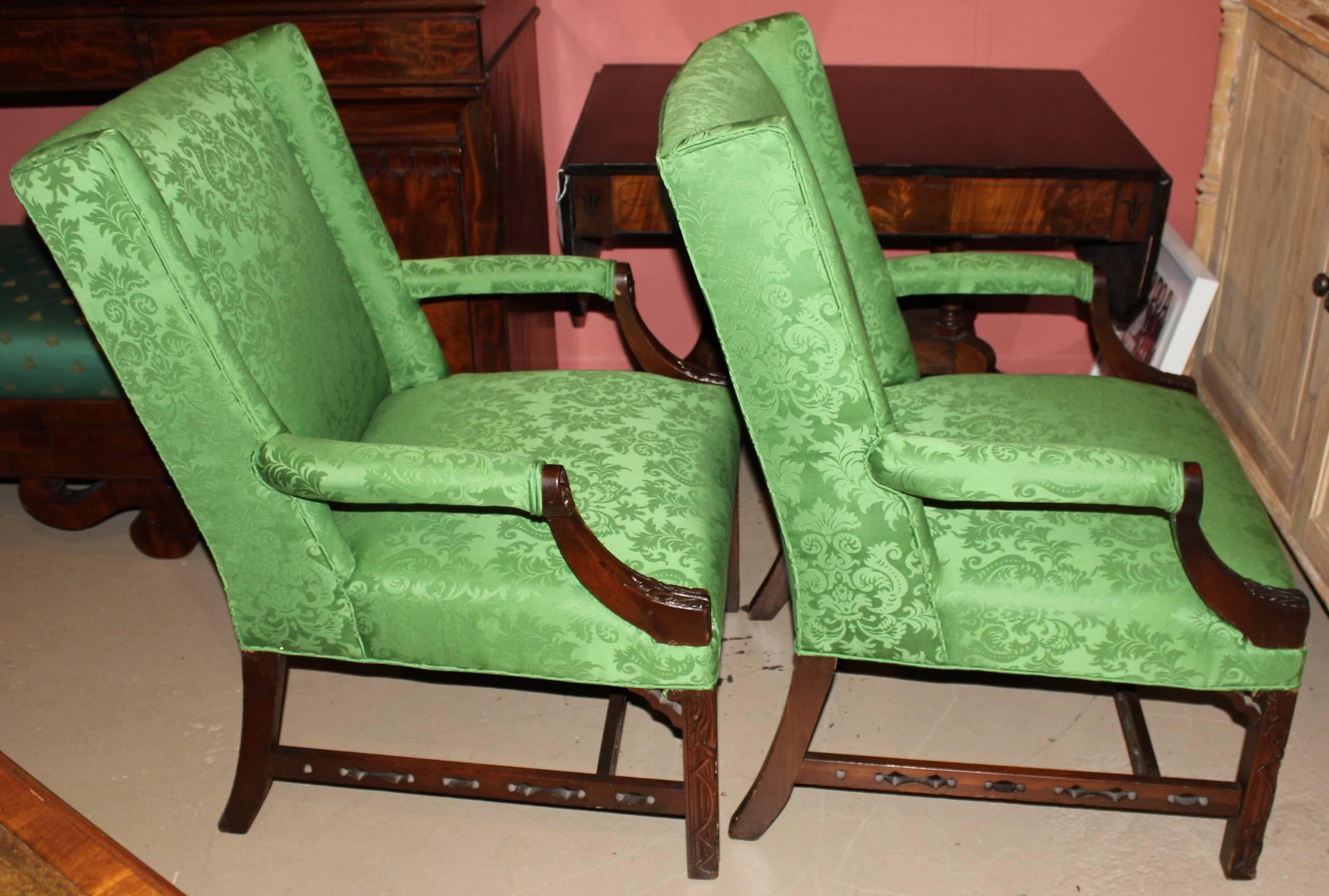 A fine pair of Chinese Chippendale style mahogany Marlborough chairs with nicely foliate carved detail on the arms and legs, as well as pierce carved stretchers, dating to the 19th century. Very good overall condition, with minor edge losses.