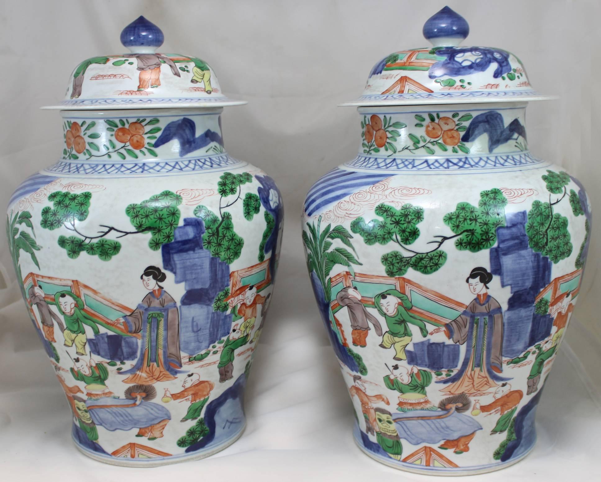 Hand-Painted Pair of 19th Century Chinese Qing Dynasty Polychrome Covered Porcelain Jars