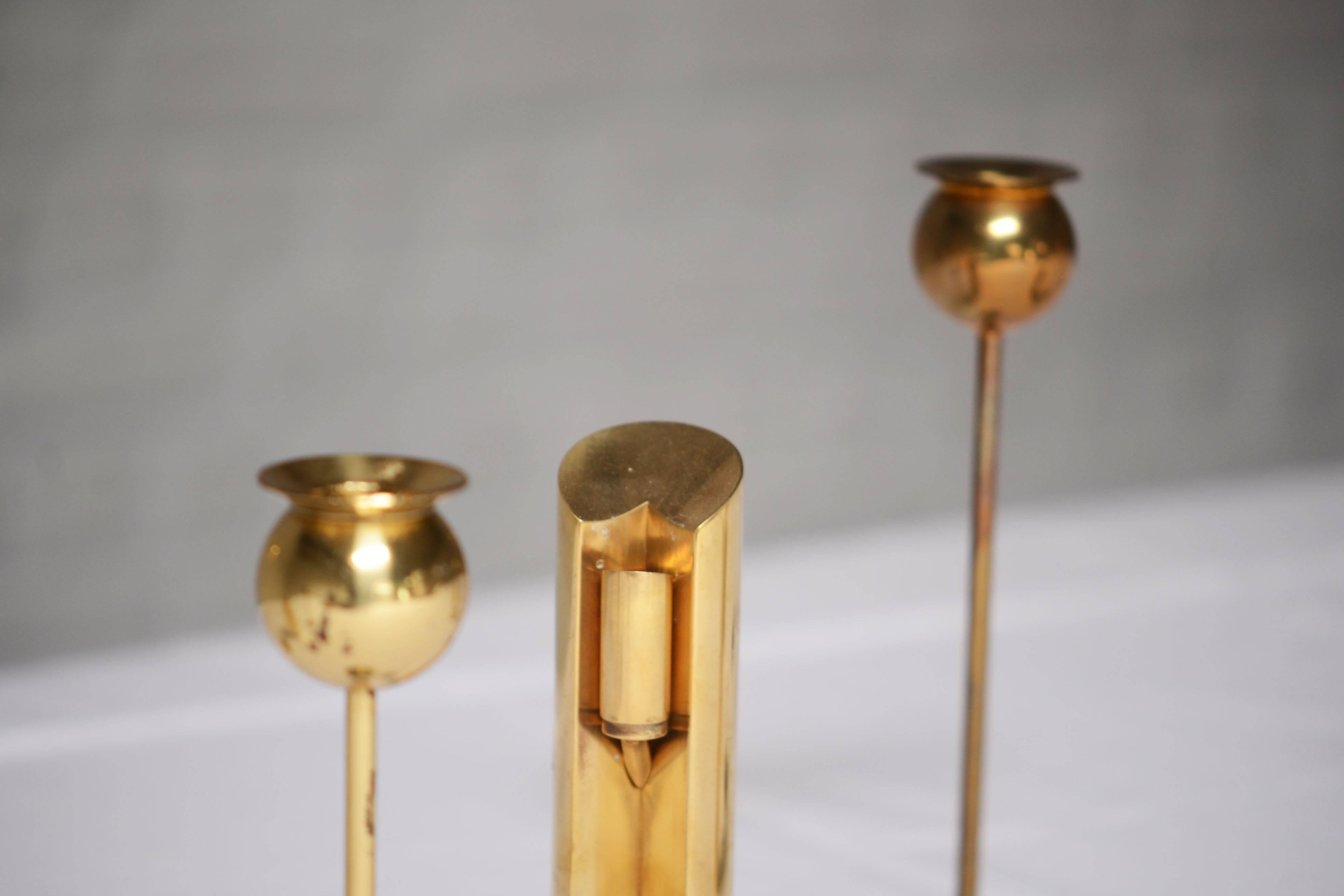 Pierre Forsell Rare Set of Nine Brass Candlesticks, Skultuna, Sweden For Sale 1