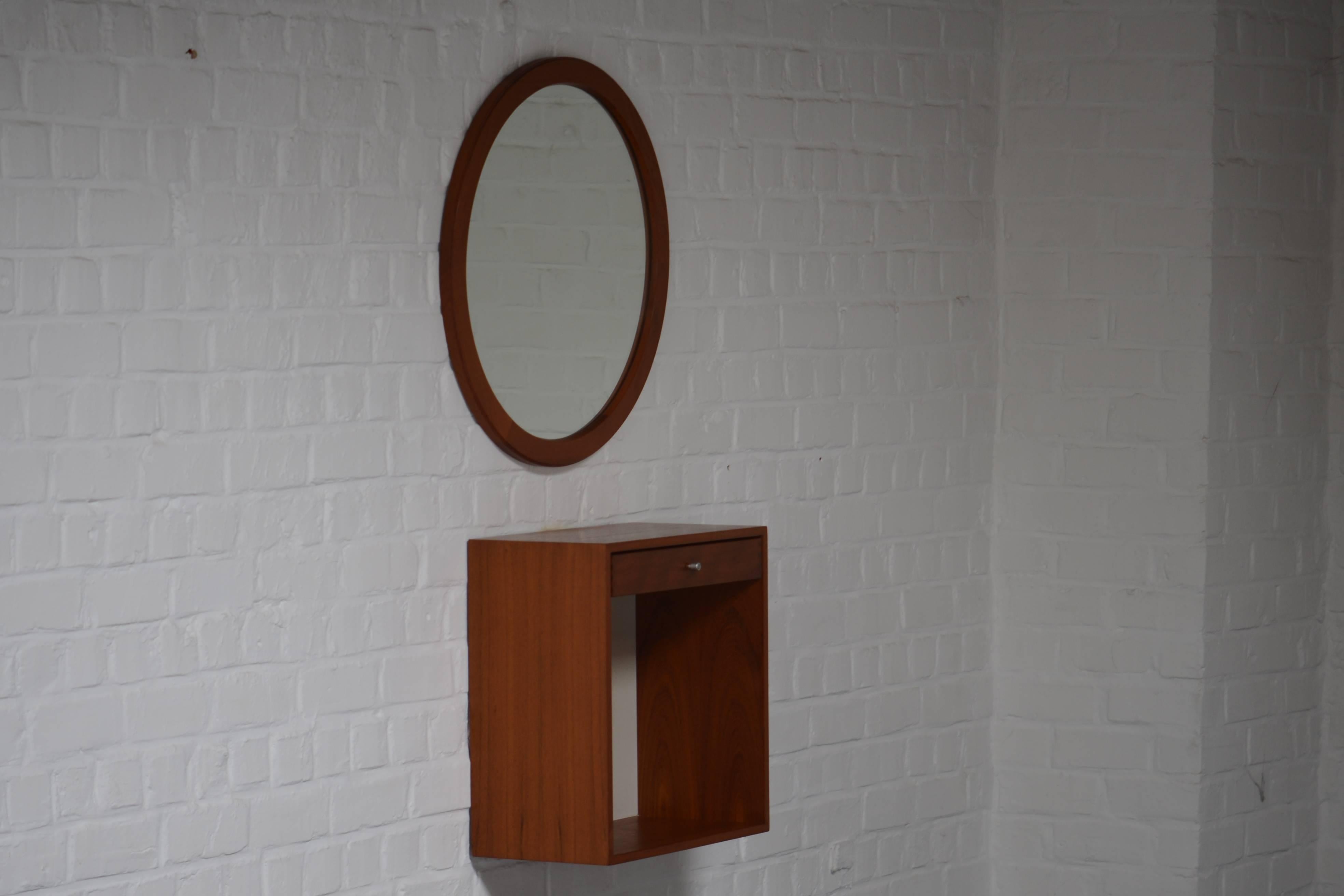 Teak square console with one drawer and a round mirror.