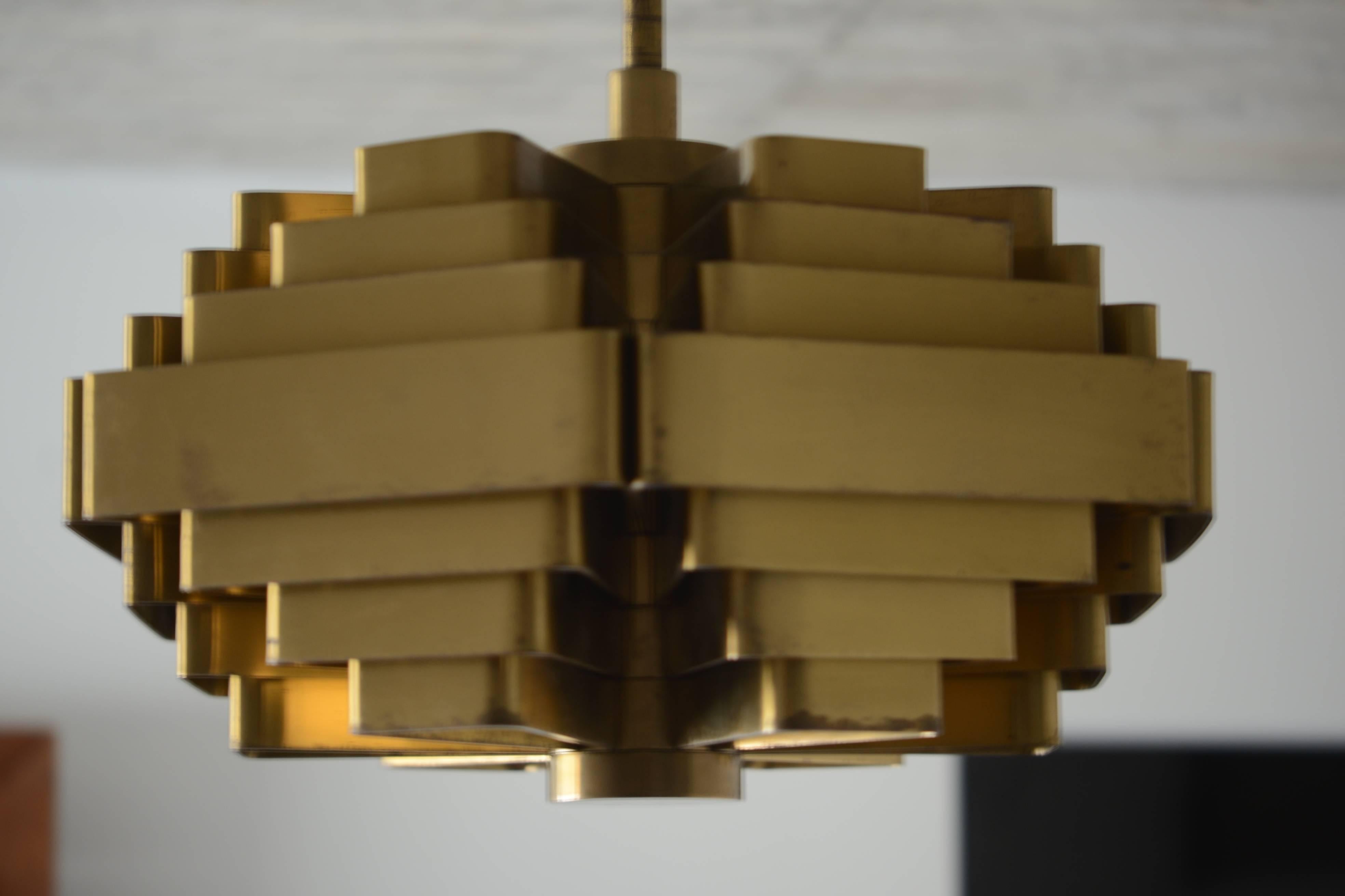 Jules Wabbes, rare large Osaka lamp made for the exhibition in 1970 in Osaka. This is the small model made of brass. There are six bulbs to create a warm light. We can assist with handling and shipping anywhere in the world. Feel free to request a