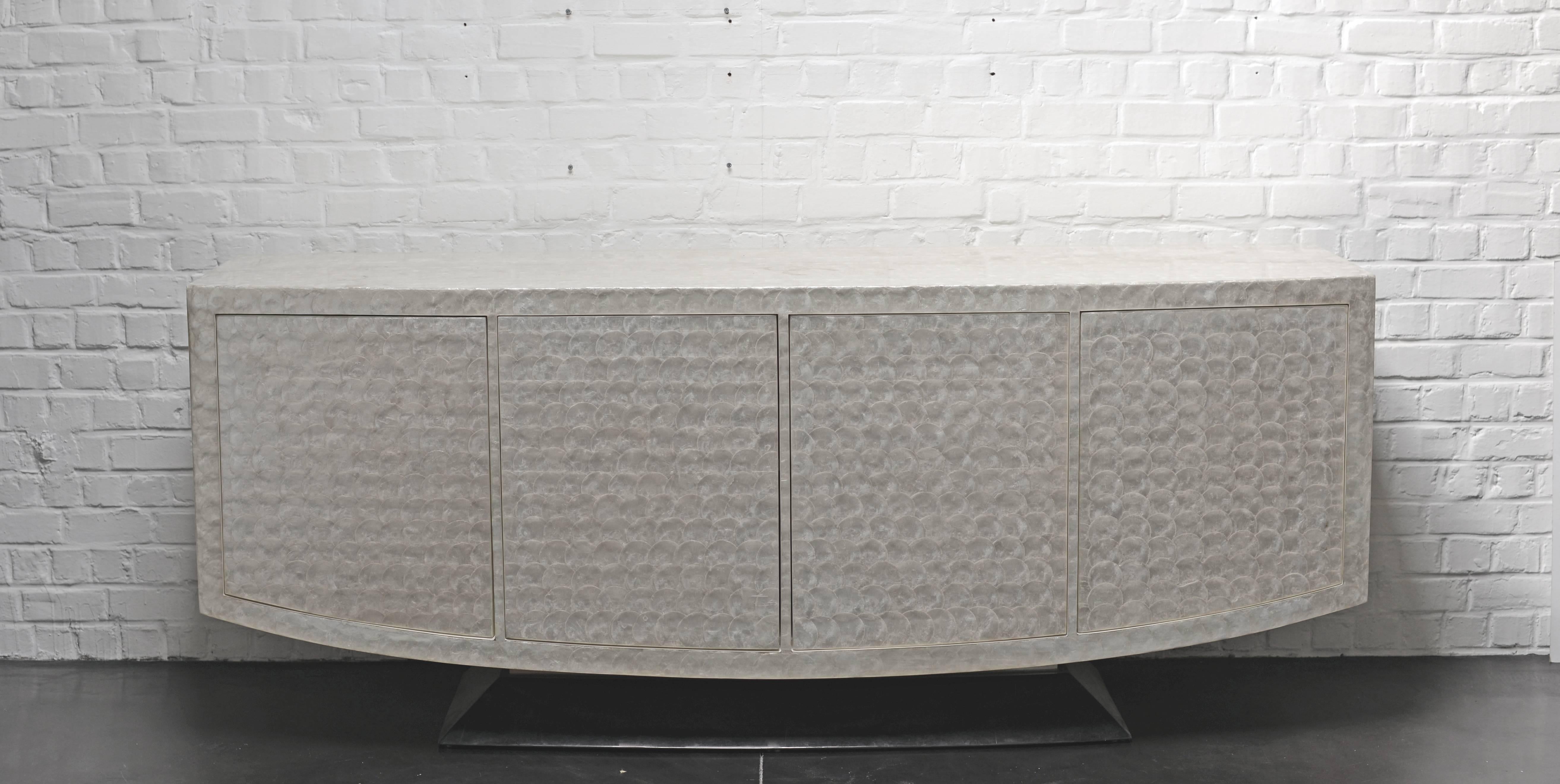 Very unique shell sideboard with four doors opening easily by pushing on them. Inside, there is one shelve on each.