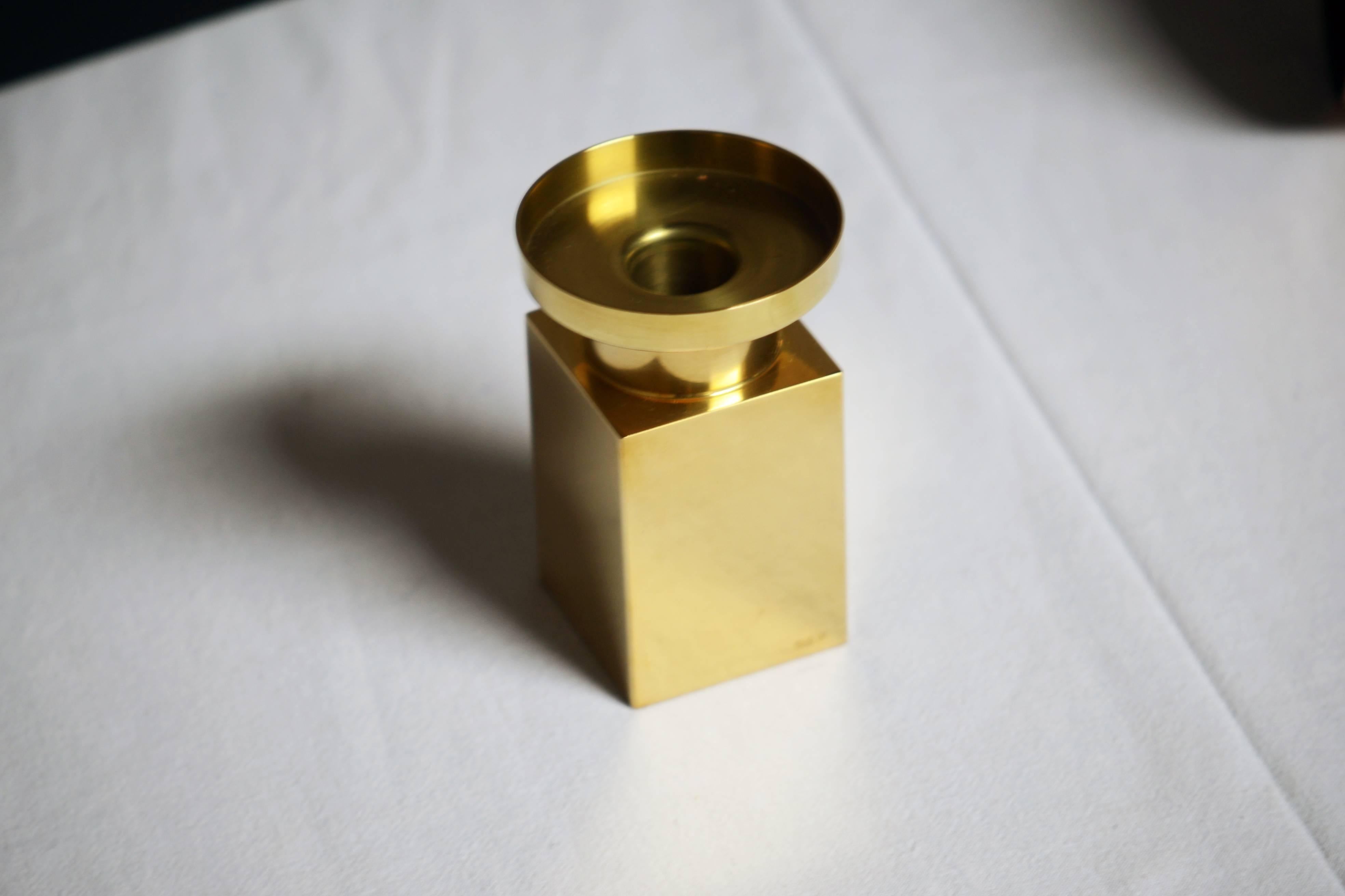 One heavy brass candlestick.

Sigurd Persson, (1914-2003). Sigurd Persson began as a silversmith, but over a long path constantly tried new genres and among other things, worked as a glass artist, designer and sculptor. During the 1950 and 1960