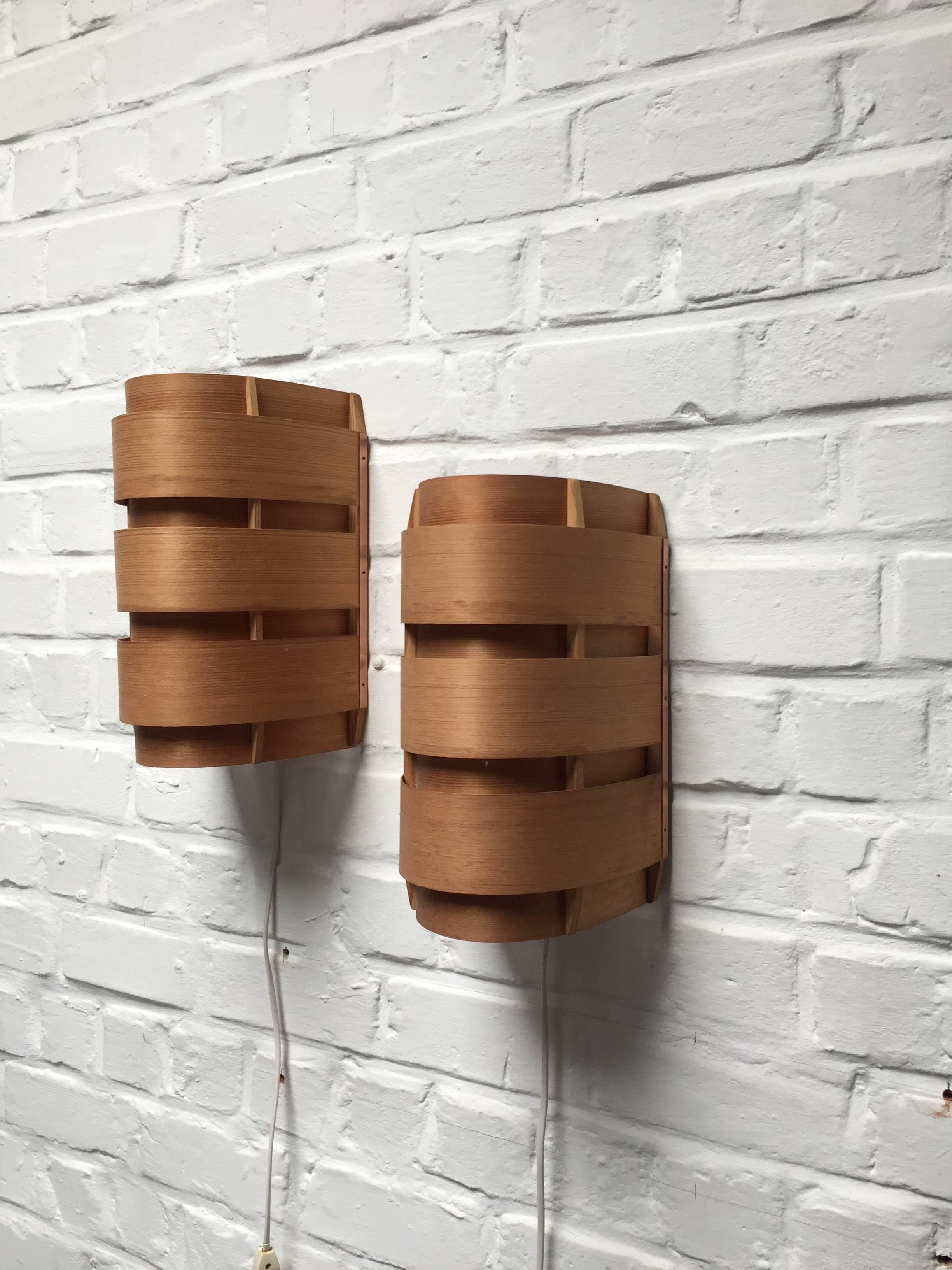 Pair of wood and copper wall lamps.
