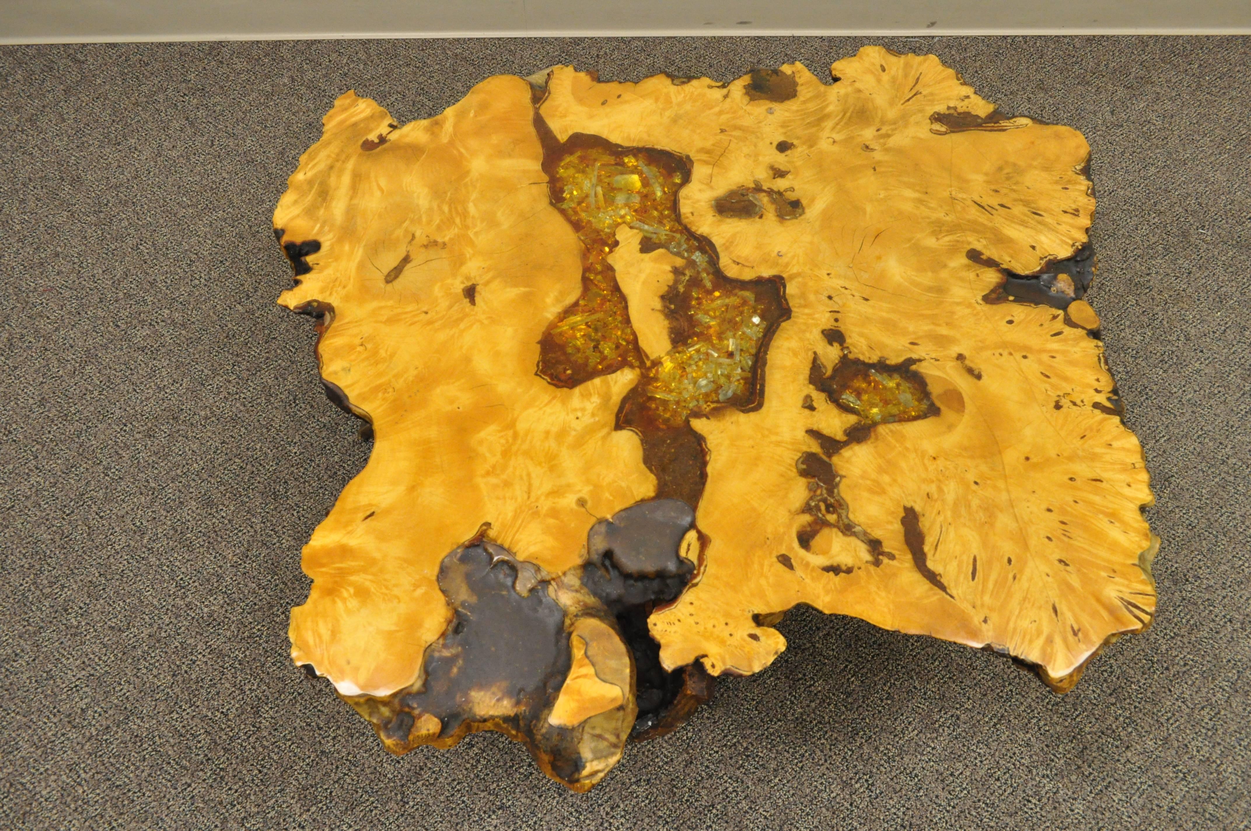 Vintage American Mid-Century Modern redwood coffee table having citrine crystal inlays, designed by The burl wood Company of Redding, California, circa 1960s. Item features a slab top with natural burl wood shape rising on a trunk base, retaining