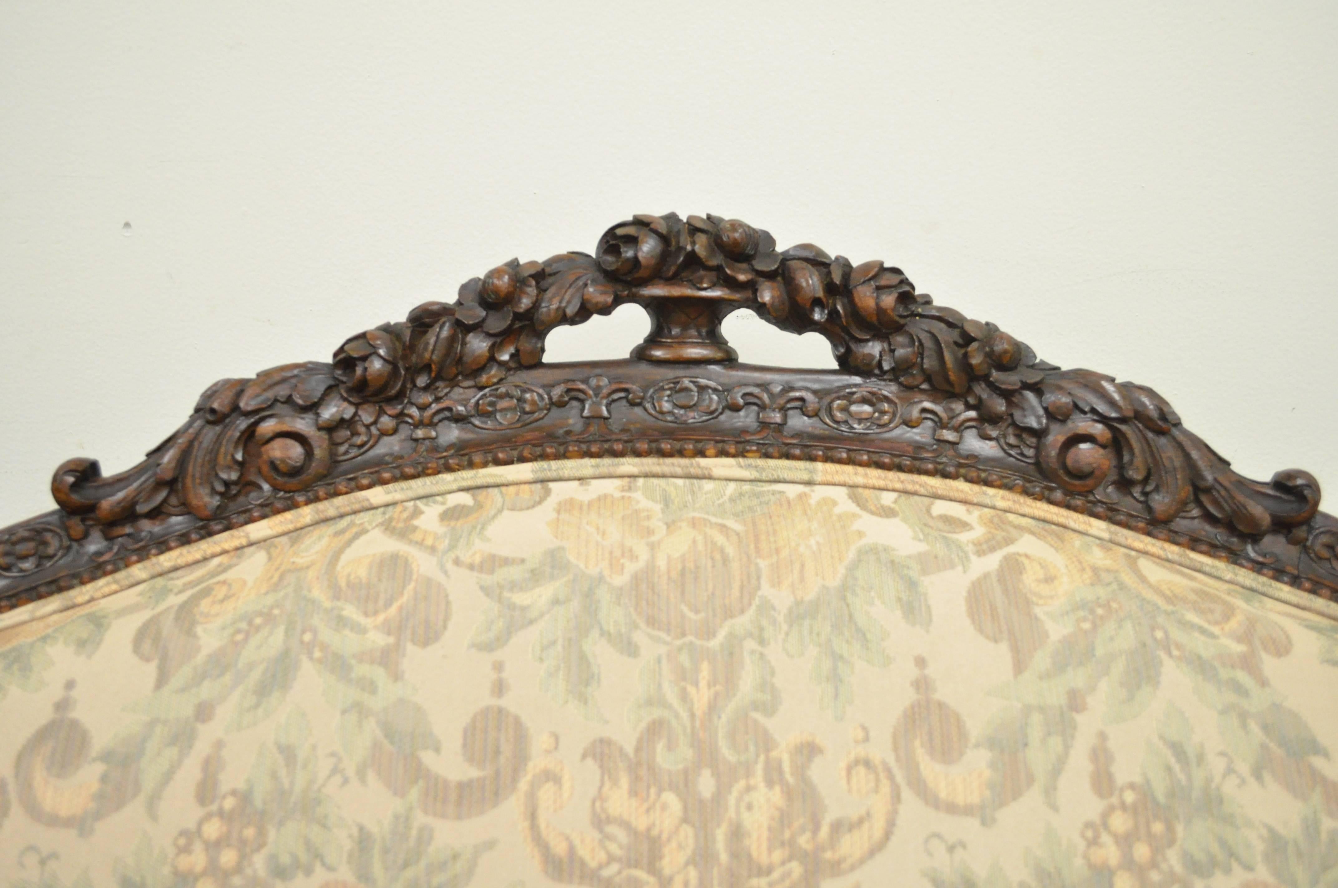 1930s French Louis XV / Hollywood Regency Style Finely Carved Mahogany Sofa. Item features 7 carved cabriole legs, floral, drape, and acanthus carved rounded frame throughout, and beautiful elegant form. 