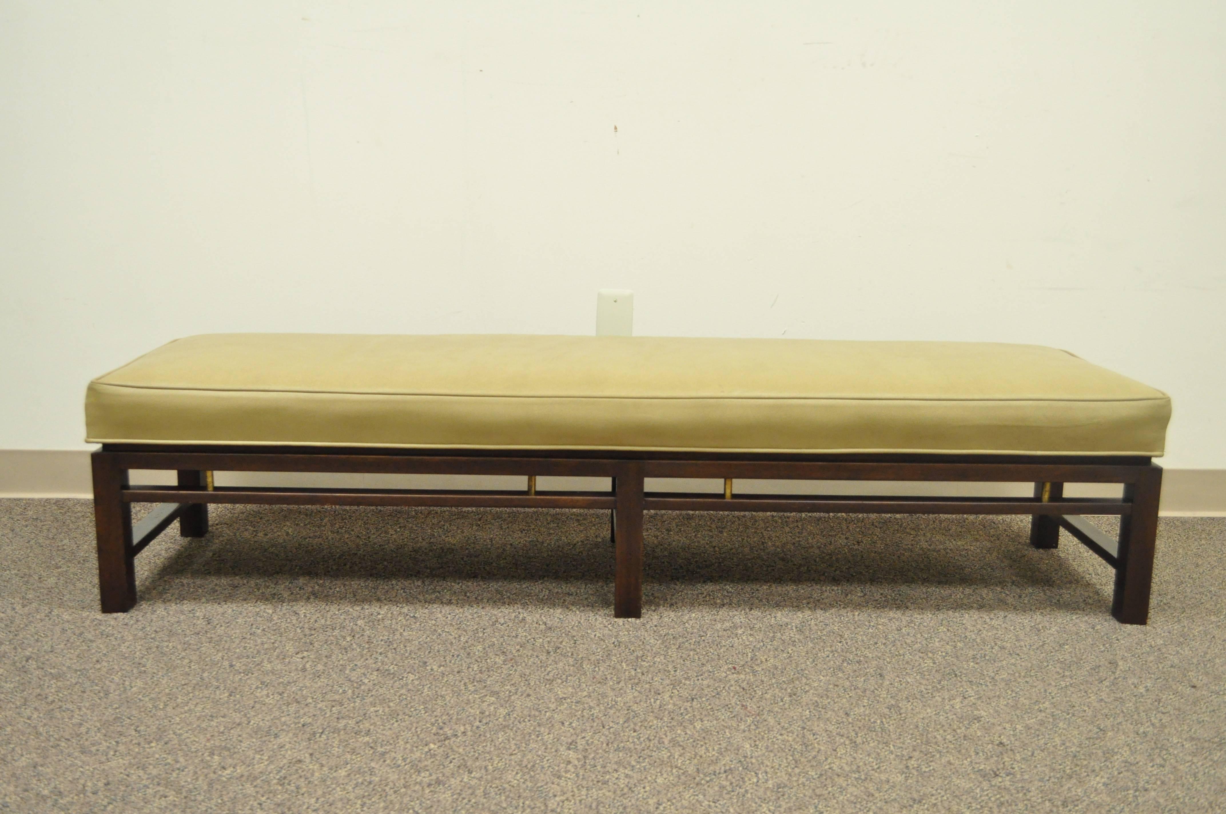 Original vintage Edward Wormley for Dunbar leather upholstered solid mahogany six-leg bench with brass accents. 