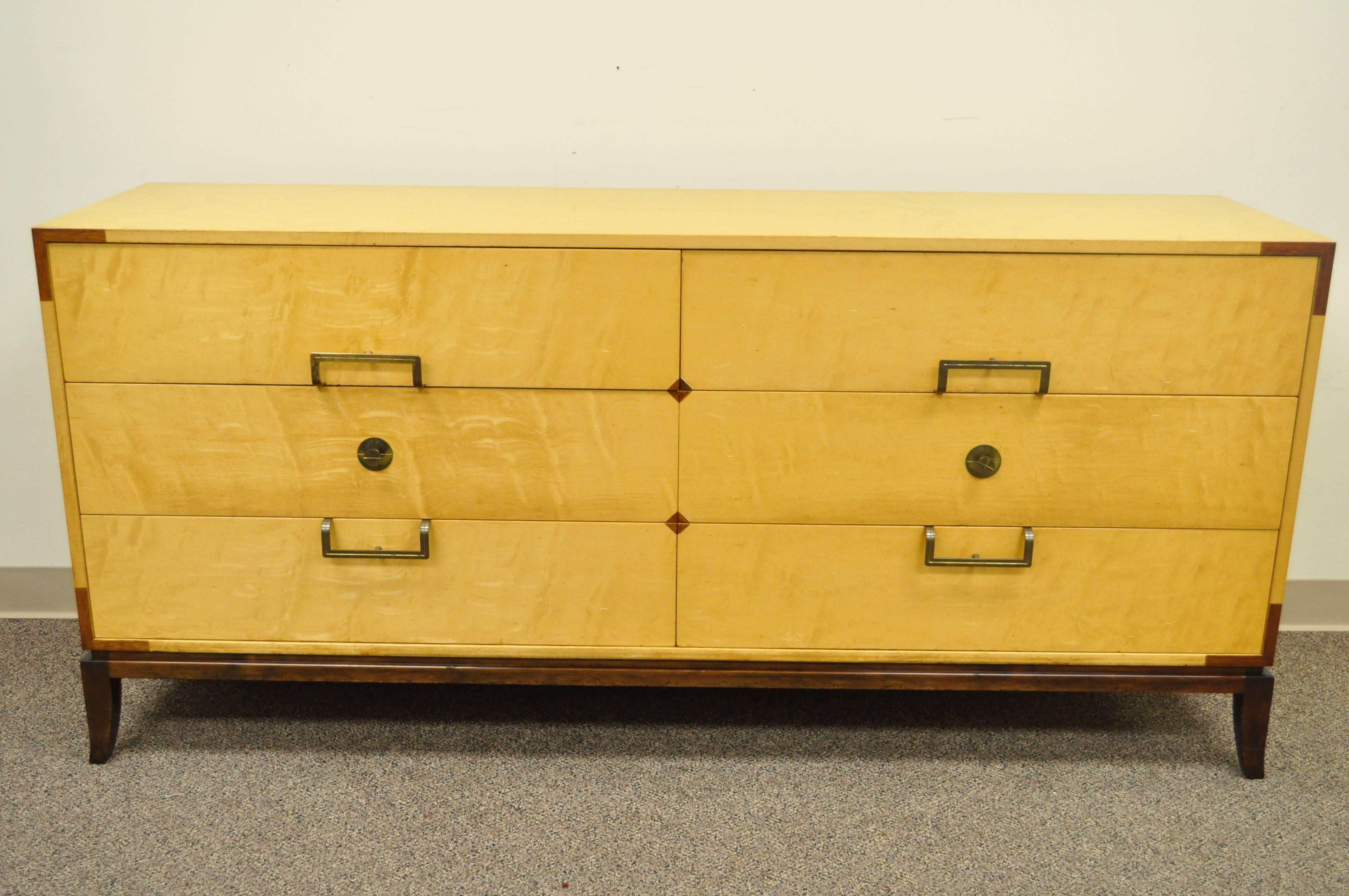 Rare Mid-Century Modern Tommi Parzinger for Parzinger Originals Maple and Mahogany Inlaid Dresser / Credenza. Item features six dovetail constructed drawers, mahogany plinth, brass Parzinger hardware and inlaid mahogany accents.