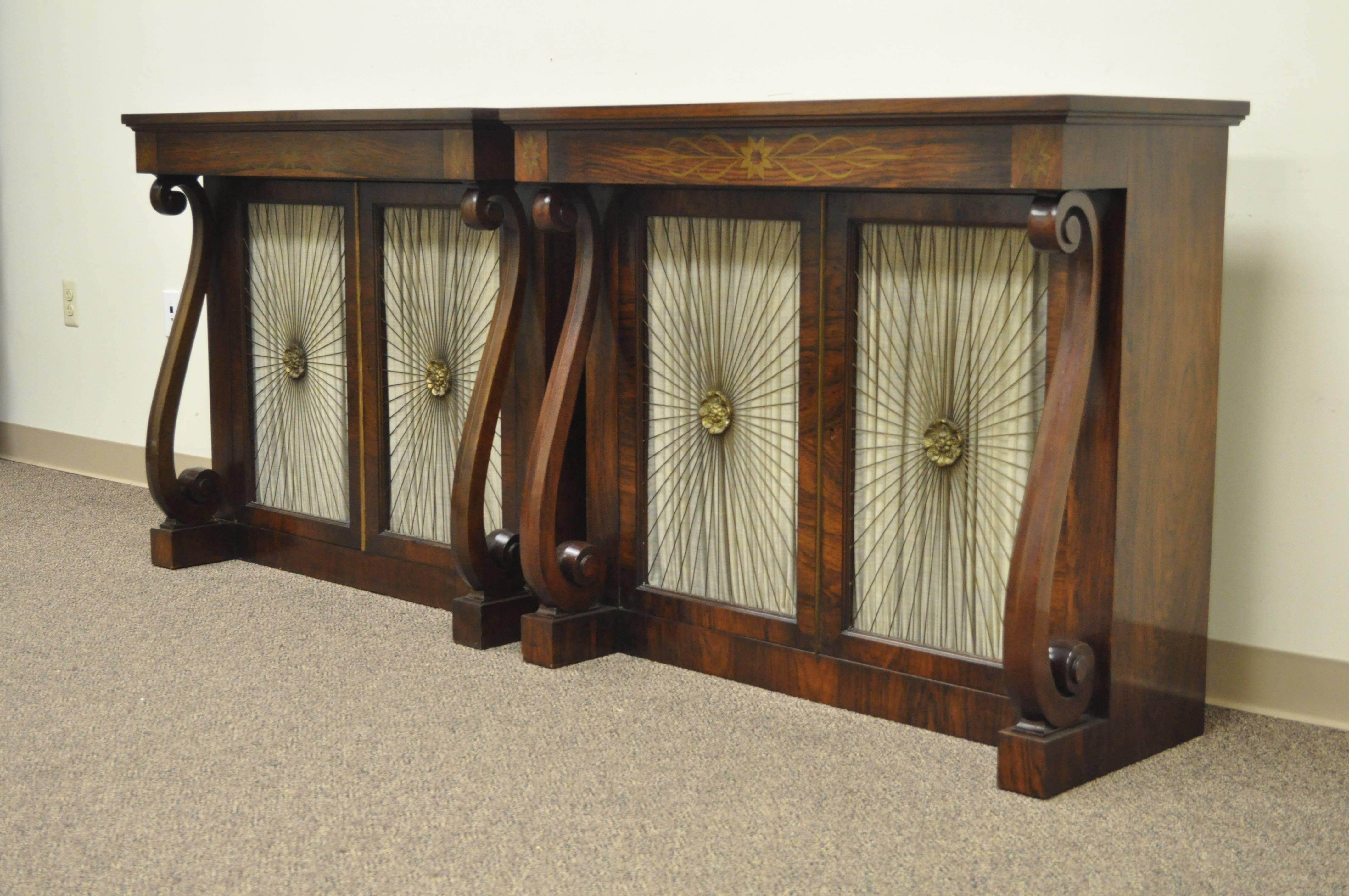 Stunning pair of vintage custom-made neoclassical / empire style rosewood console or hall tables by Daniel Jones Inc. NY. The pair of features dovetail constructed drawers with decorative brass inlay, lower cabinet doors with brass sunburst grills,