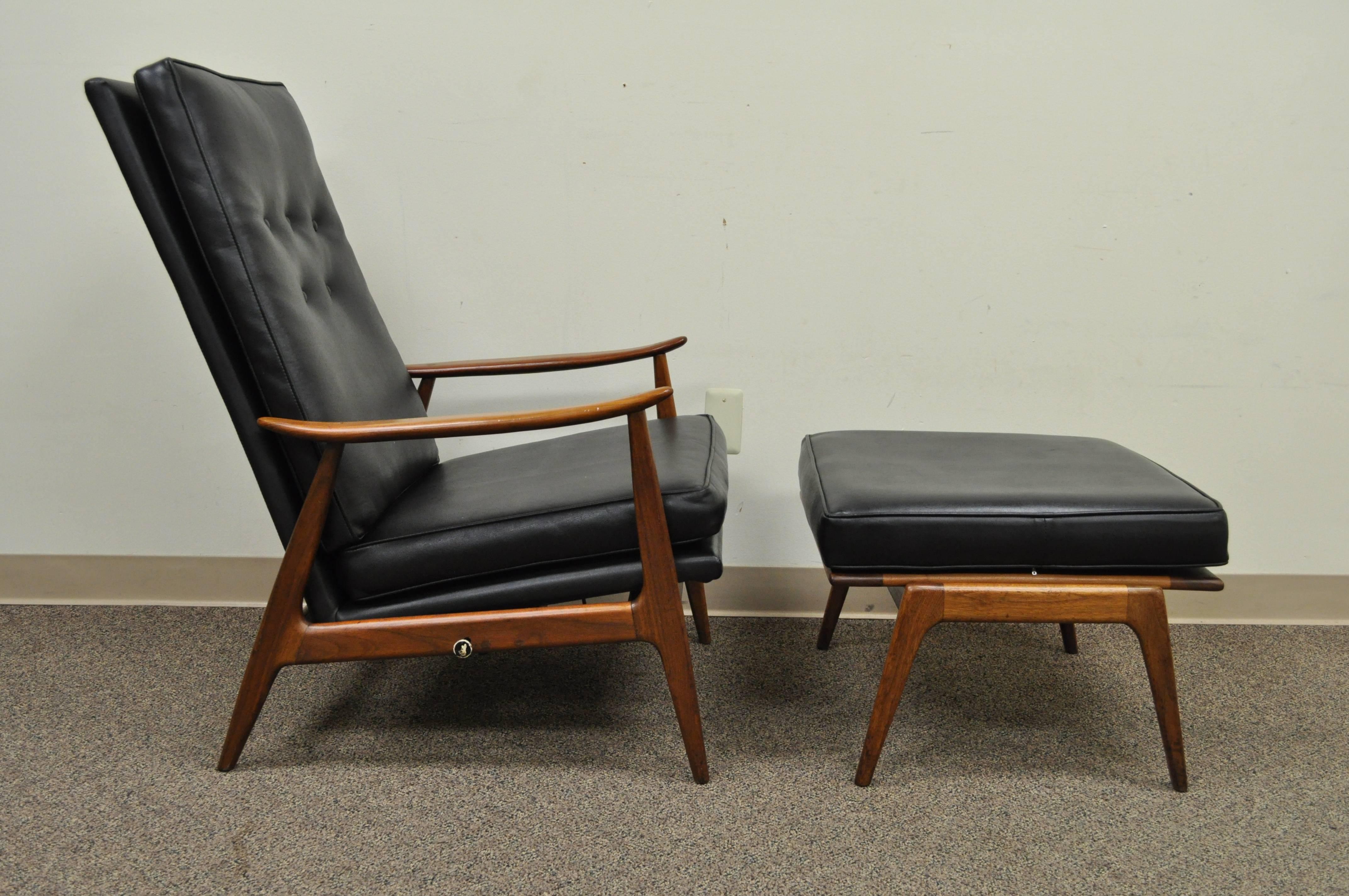 Early Milo Baughman designed sculpted frame reclining walnut lounge chair and matching ottoman for James, Incorporated (An early division of Thayer Coggin) Chair features eight very comfortable reclining positions and the original black vinyl