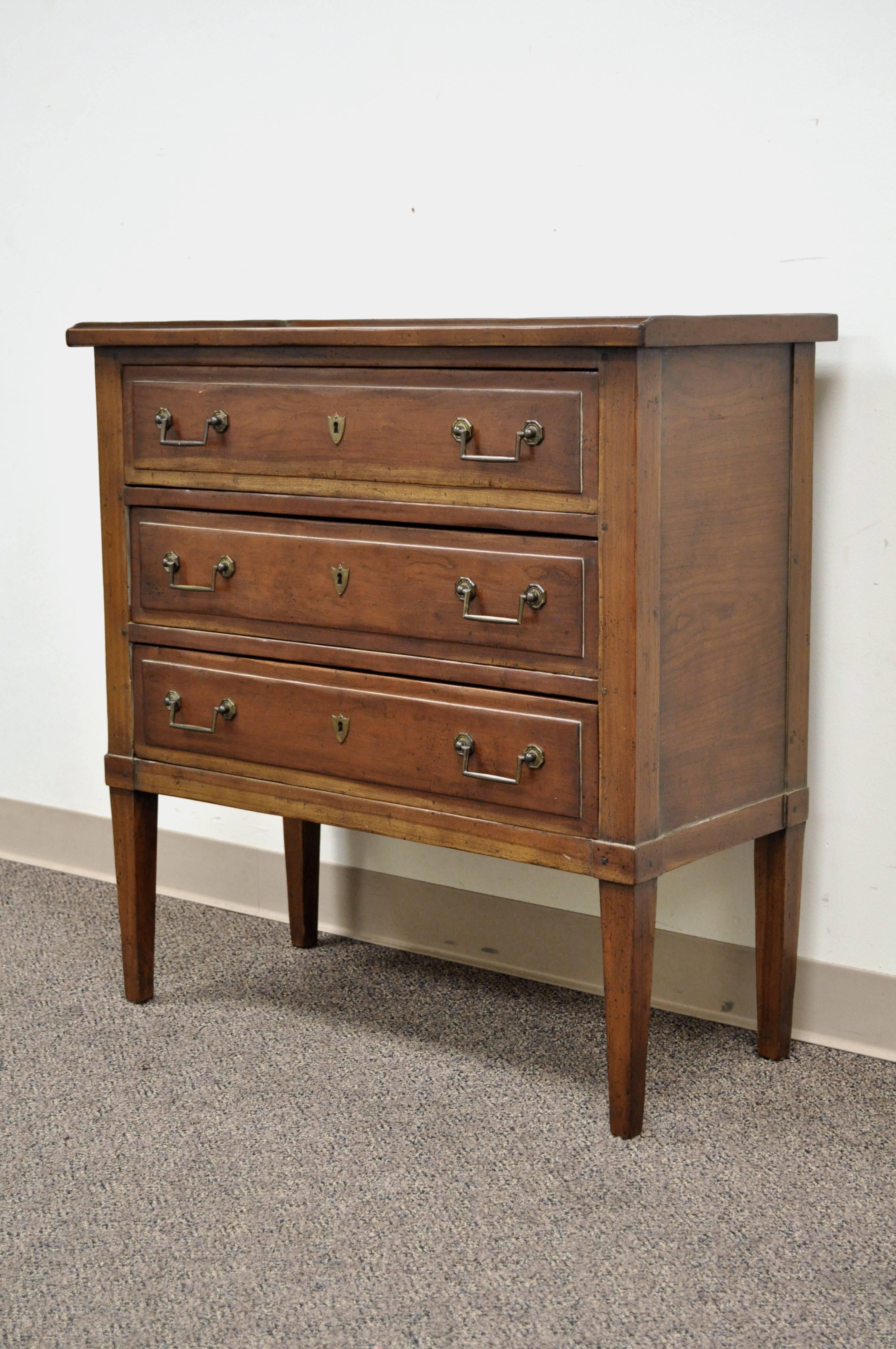 Remarkable quality custom-made solid cherry French Directoire style commode or bachelor chest by Customwood of Harrison, NY. Item features three dovetail constructed drawers, gallery top, lined drawers, solid brass hardware, exposed wood pin