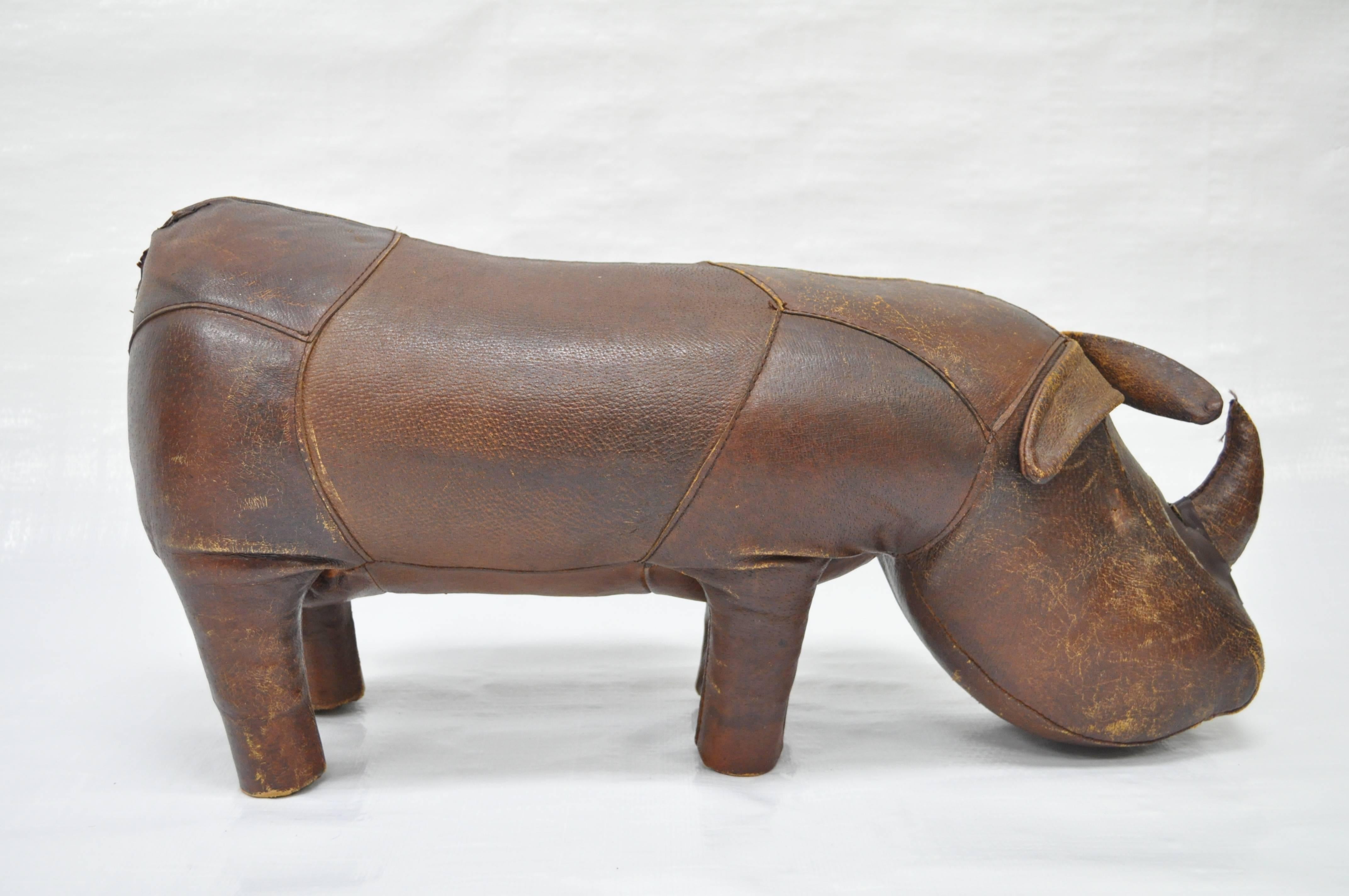 Vintage 1970s distressed brown leather rhino footstool or decorative object by Sarreid. Great quality hand stitched football leather. Metal stud feet. Made in Spain.
