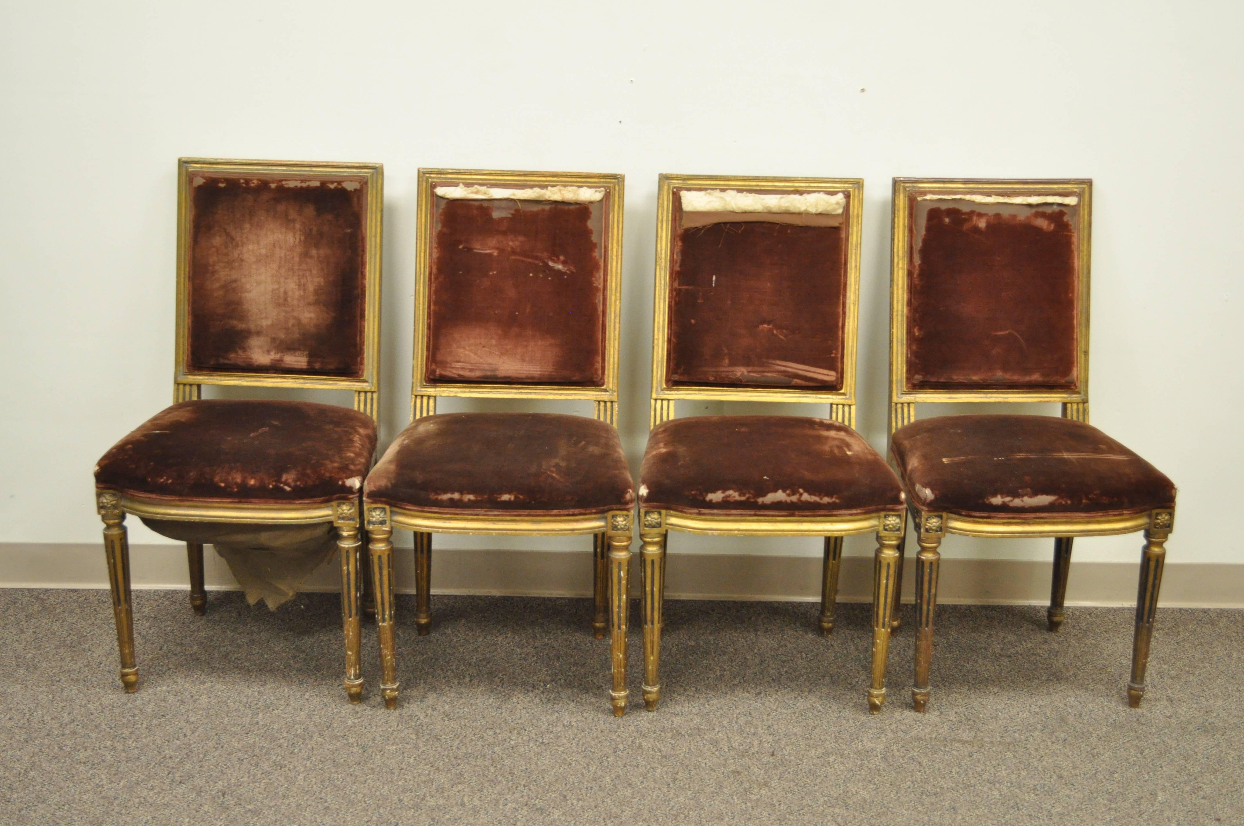 Set of four elegant French Louis XVI style giltwood dining chairs. These late 19th century French side chairs features reeded and tapered legs, square backs and Classic Louis XVI form. Original antique condition.