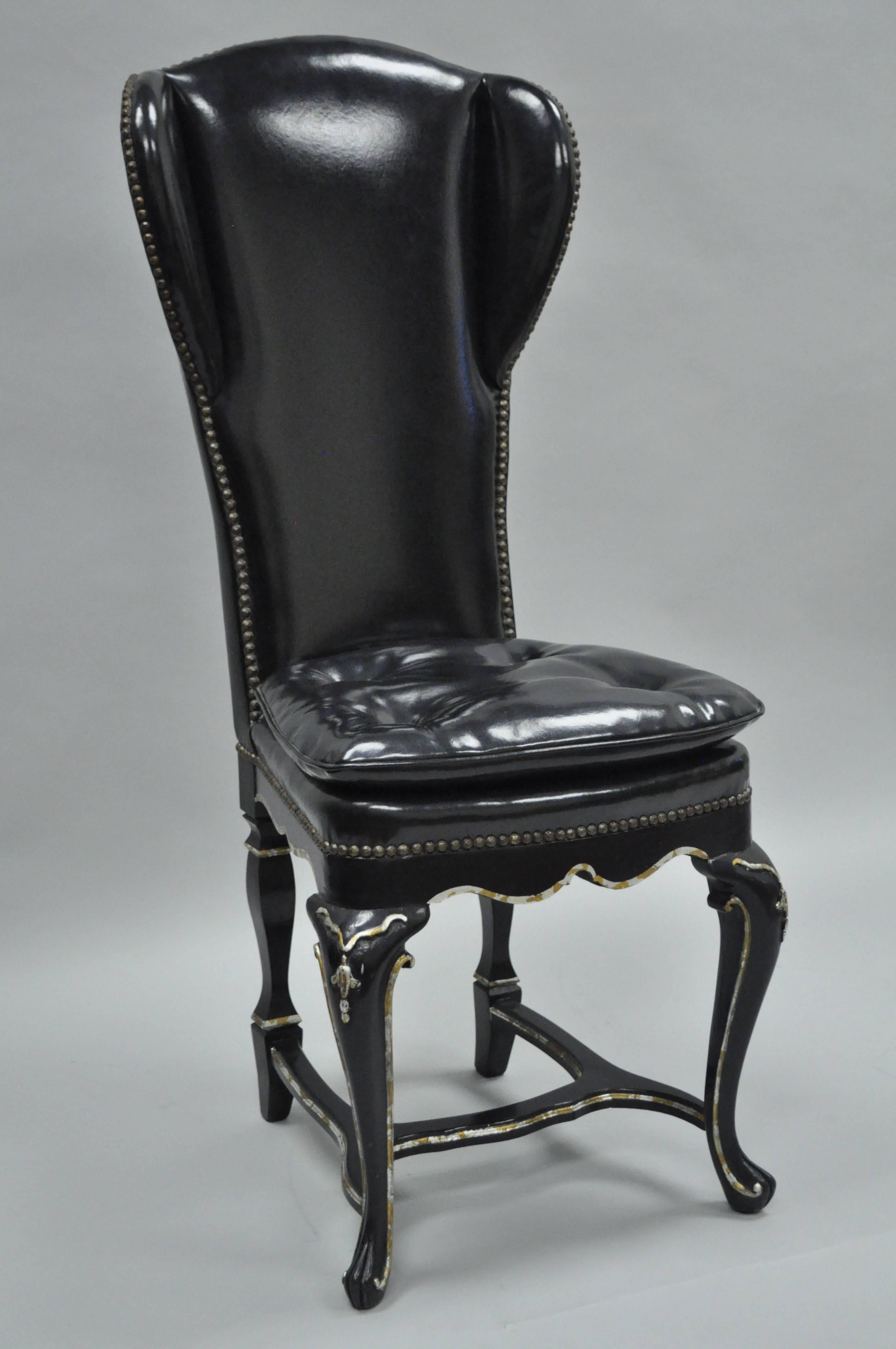 Very unique ebonized side chair in the Swedish Rococo style. Item features a shapely solid wood wing back frame, stretcher supported base, all finished in a gloss black lacquer with hand-painted faux mother-of-pearl trim. Chair is further accented