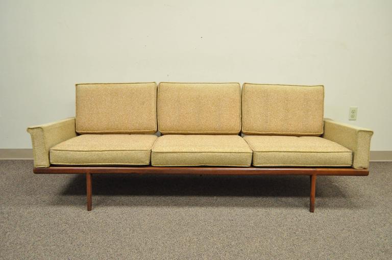 Vintage Mel Smilow for Smilow-Thielle, Mid-Century Modern Danish Style teakwood sofa. Item features a solid wood frame with exposed sculpted spindle back, loose cushions, upholstered armrests, clean modernist lines, comfortable form. 20