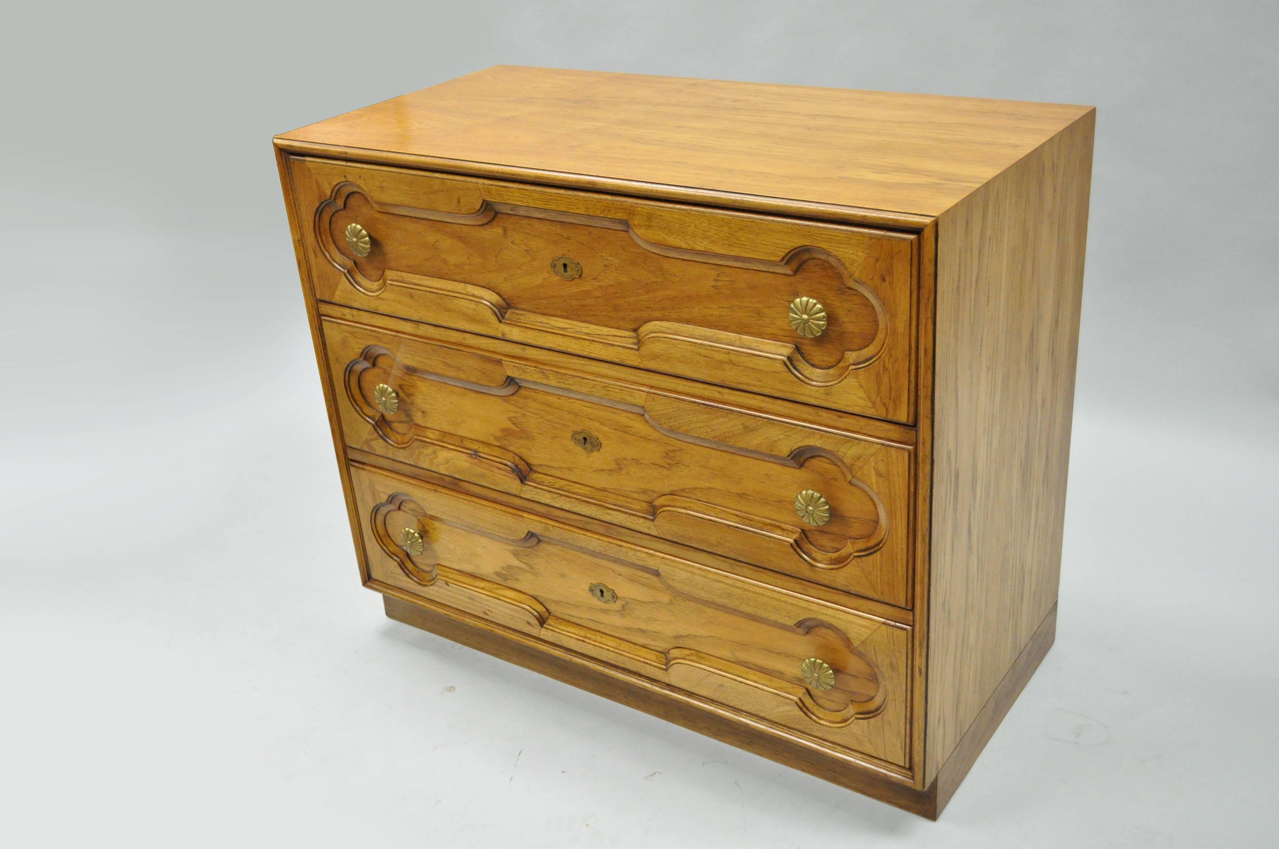 Quality three-drawer commode by Drexel Heritage. Item features solid brass hardware, dovetail constructed drawers, carved drawer fronts and clean lines. Style and quality is very similar to that of Dorothy Draper. Designer is unconfirmed.