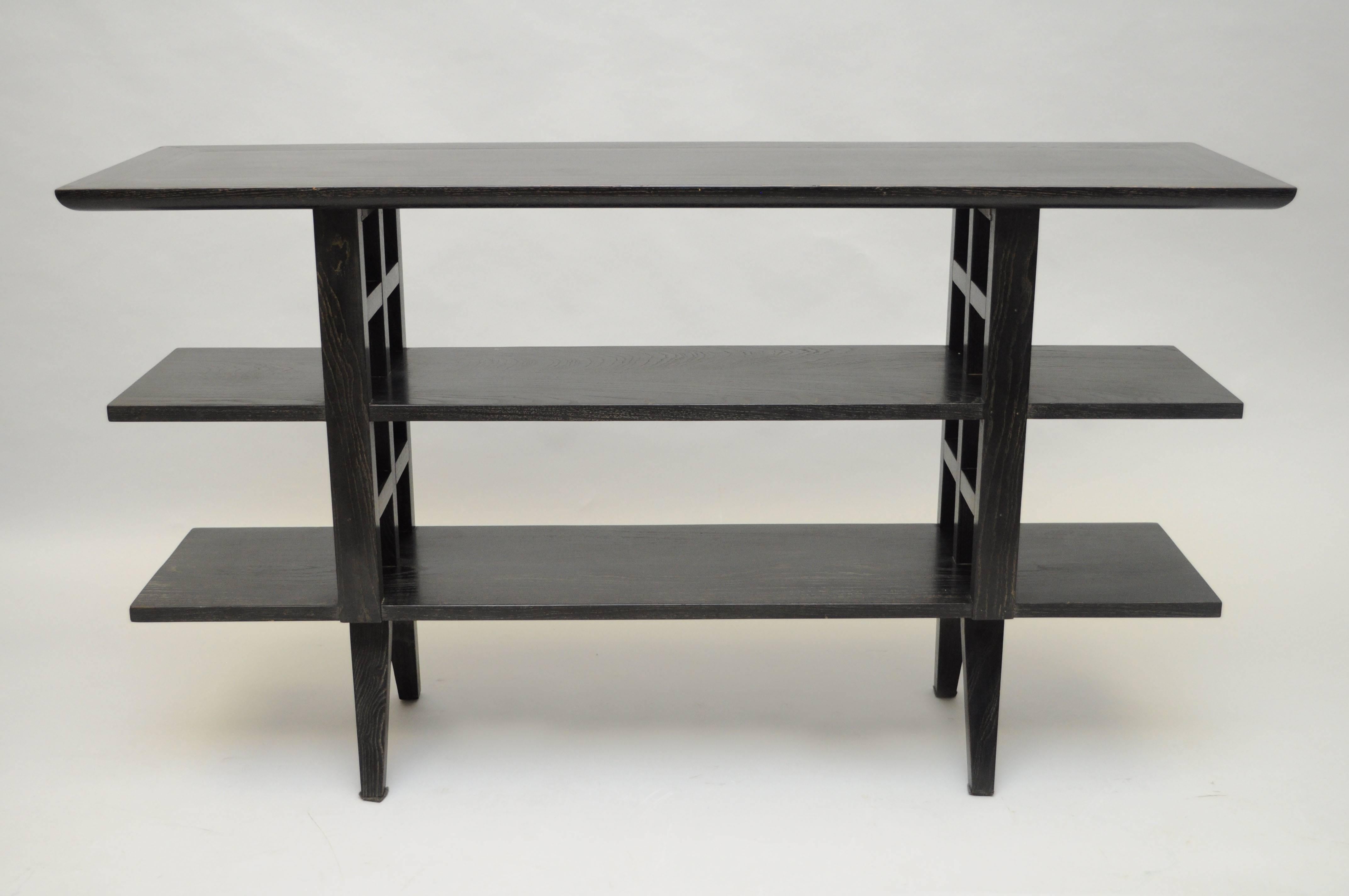 Vintage Mid-Century Modern, Asian inspired, ebonized cerused oak console table by Martin California in the manner of James Mont. Item features beautiful cerused oakwood grain throughout, three bookshelf tiers, lattice cut-out design to the sides,