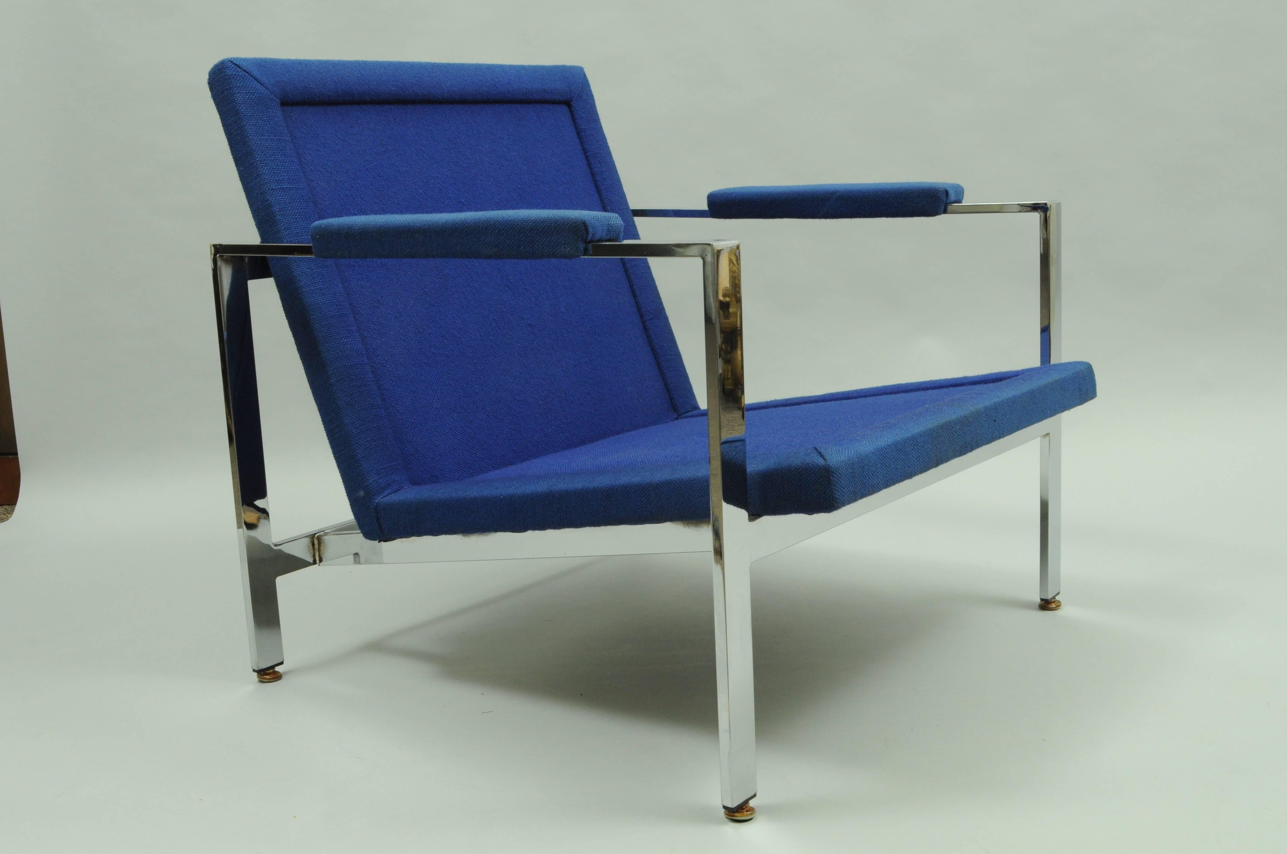 Striking vintage Mid-Century Modern flat bar chrome club chair attributed to Milo Baughman for Thayer Coggin. The chair features a sleek polished chrome frame with blue upholstered seat and armrests. Does not come with cushions.
