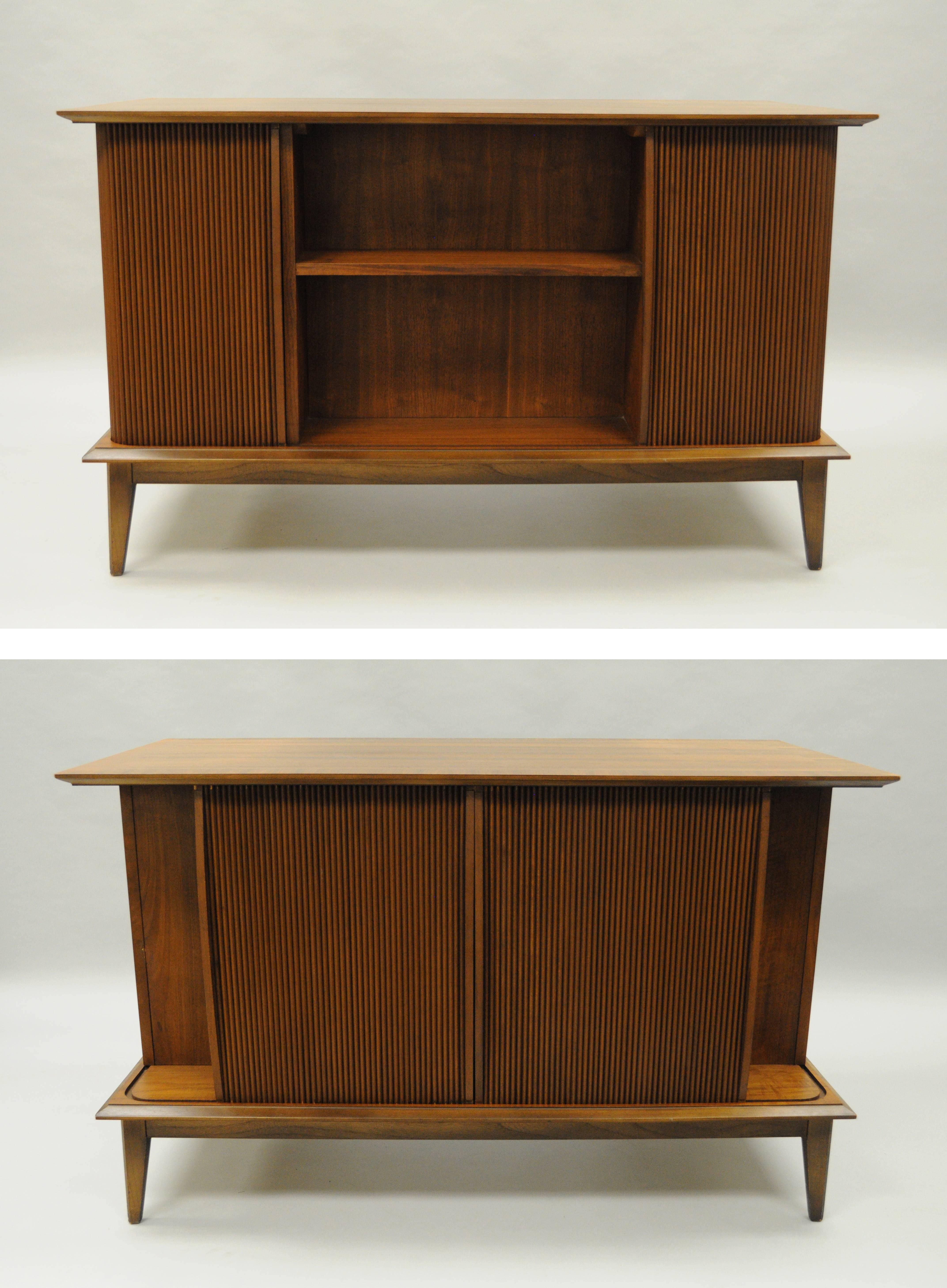 Mid-Century Modern vintage teak and walnut kneehole writing desk from the 