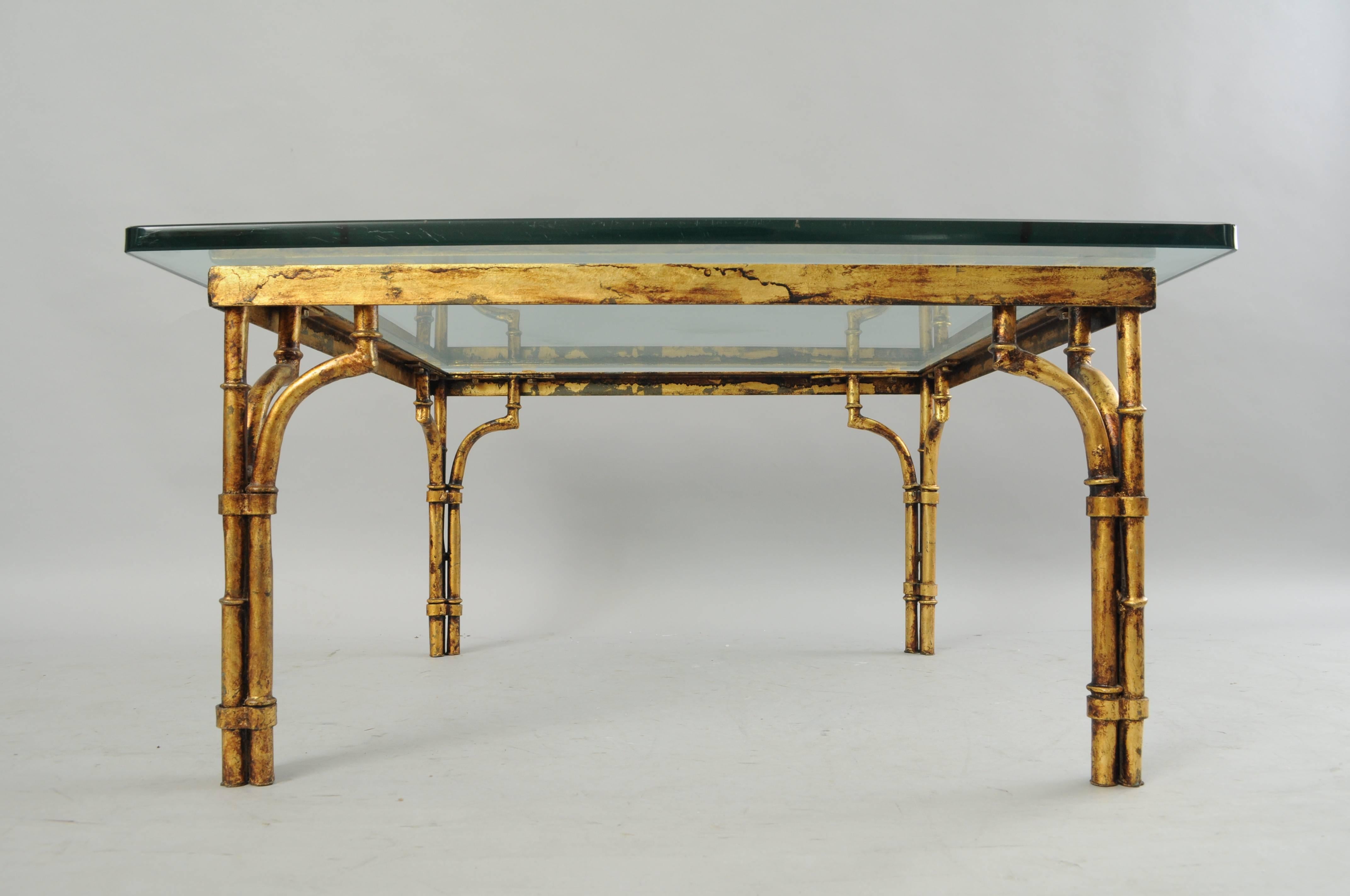 Vintage Italian Hollywood Regency gold gilt iron and glass faux bamboo square coffee table. Item features a 1