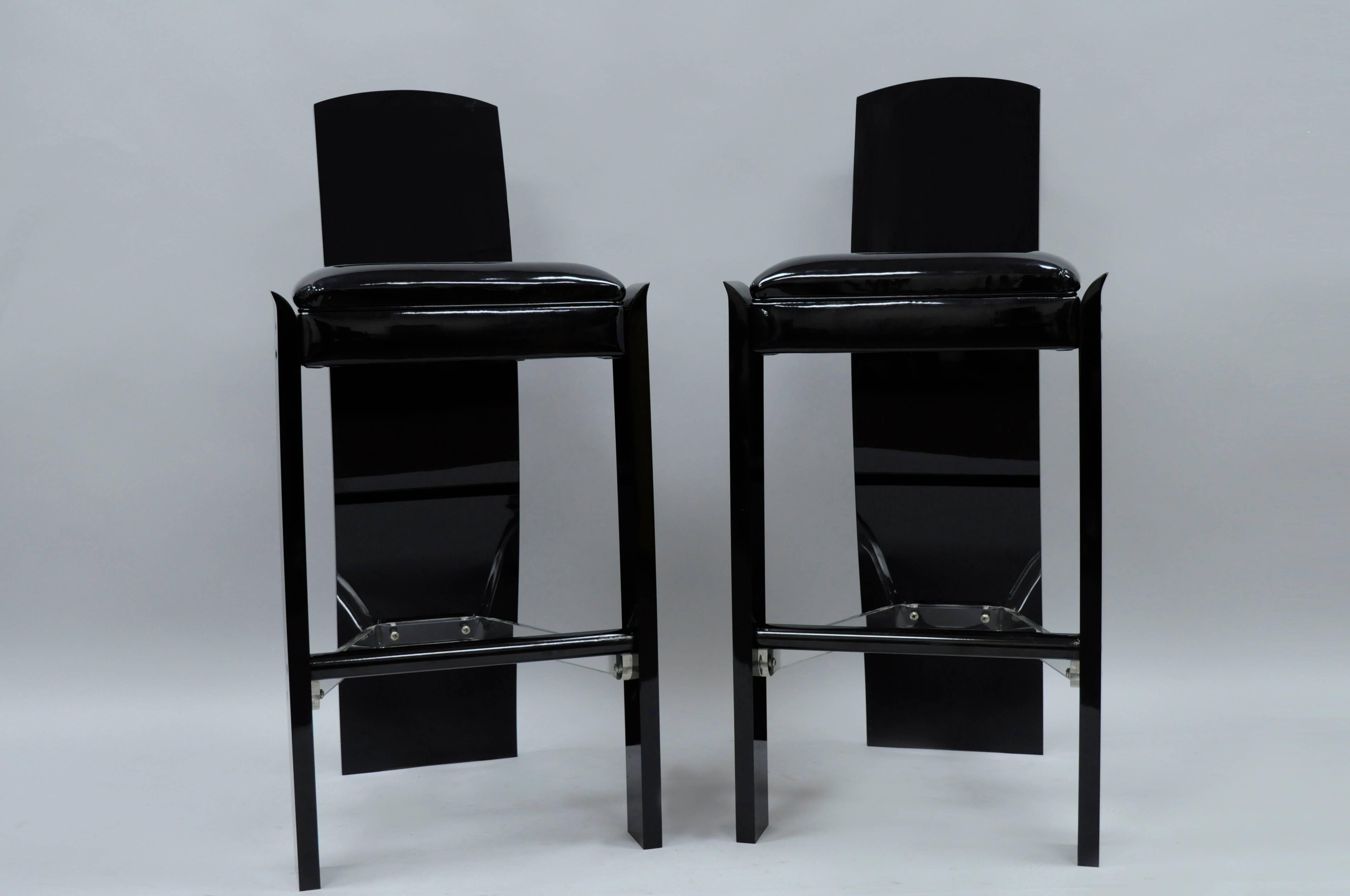 Pair of Vintage Mid Century Modern Black Lucite Acrylic Sculptural Bar Stools by Hill Manufacturing in the manner of Charles Hollis Jones. Item features thick lucite construction, clear lucite stretcher supports, black metal footrests, black patent